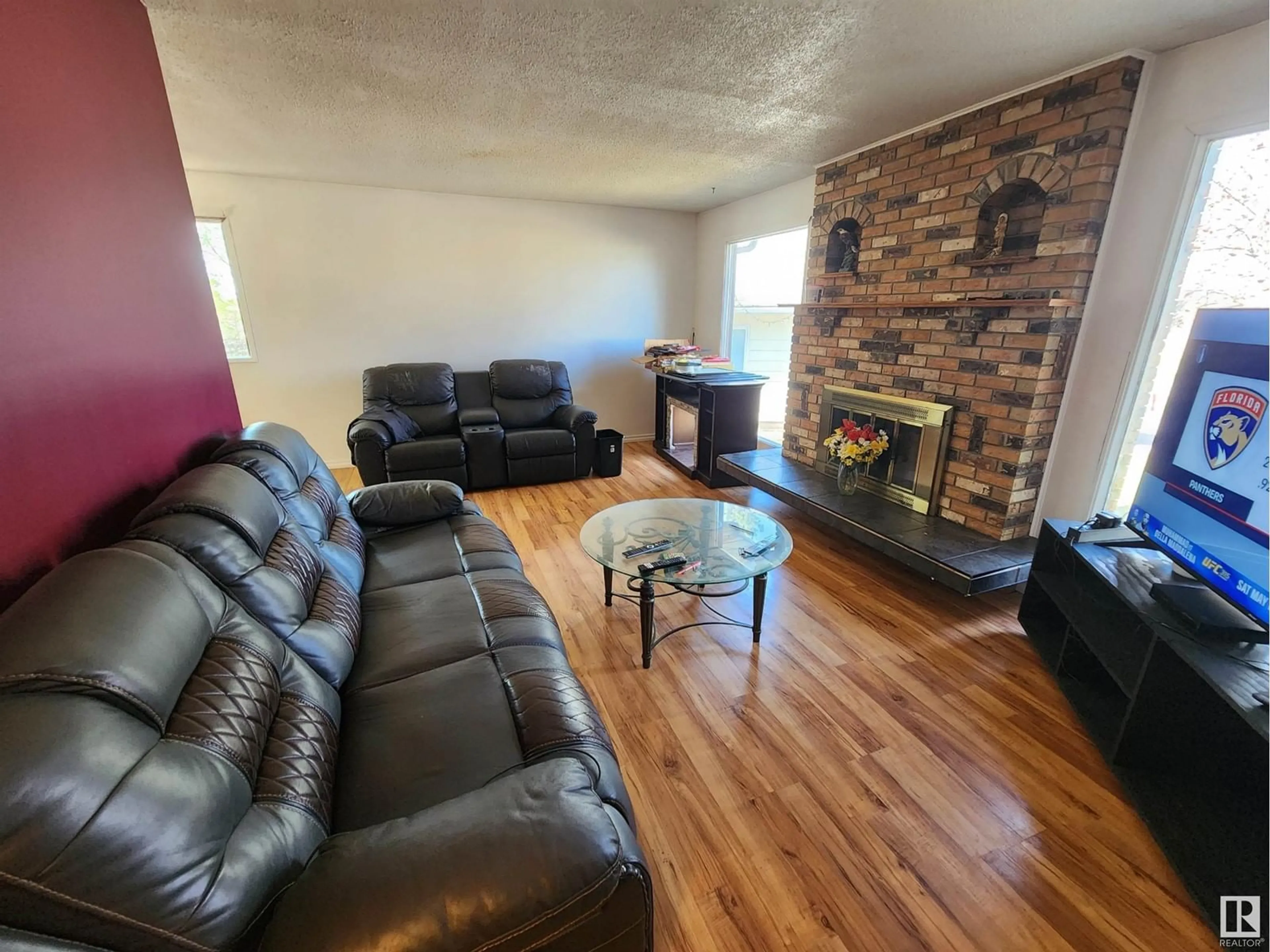 Living room with furniture, wood/laminate floor for 4103 43 ST, Bonnyville Town Alberta T9N1R6