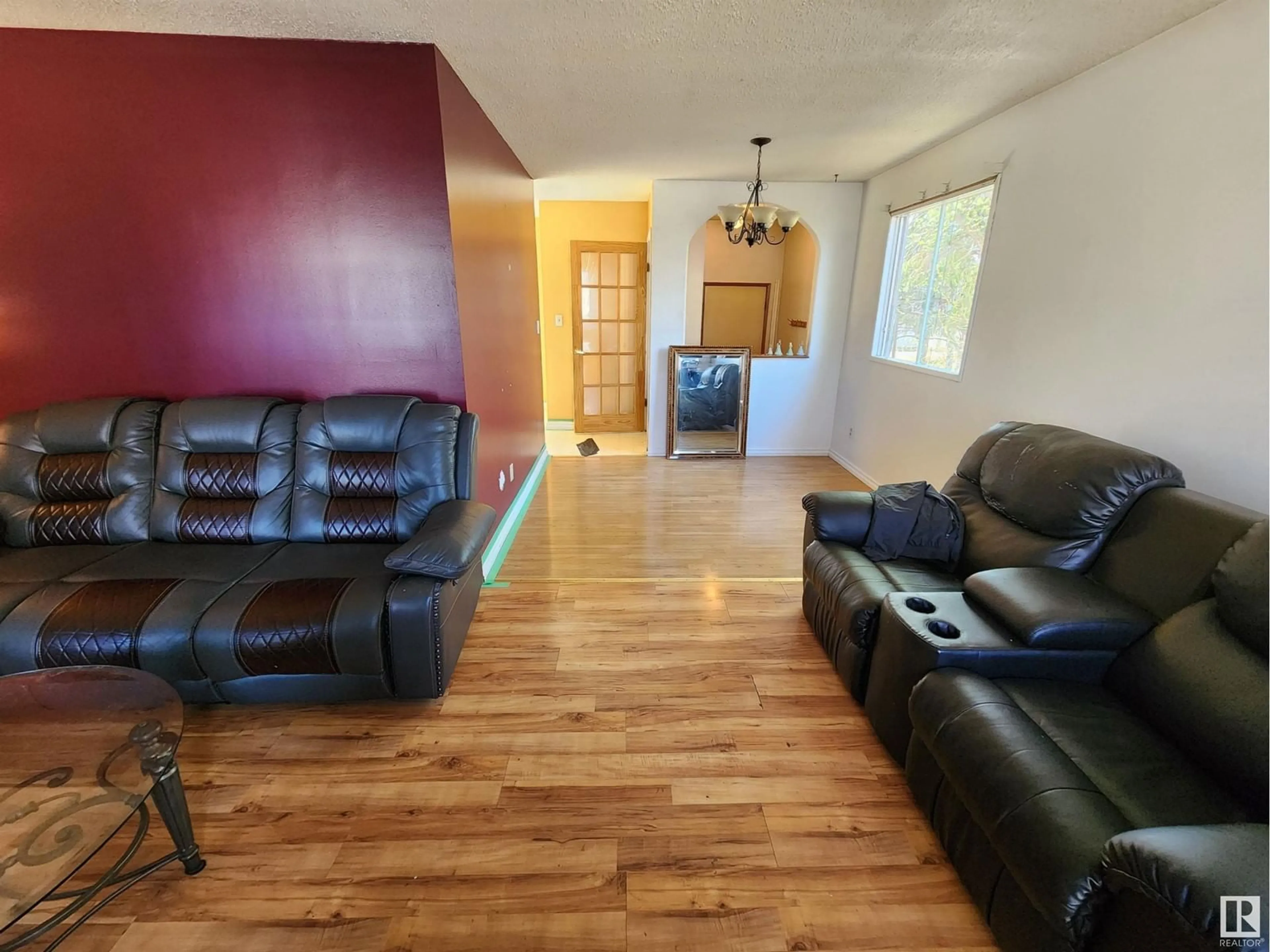 Living room with furniture, wood/laminate floor for 4103 43 ST, Bonnyville Town Alberta T9N1R6