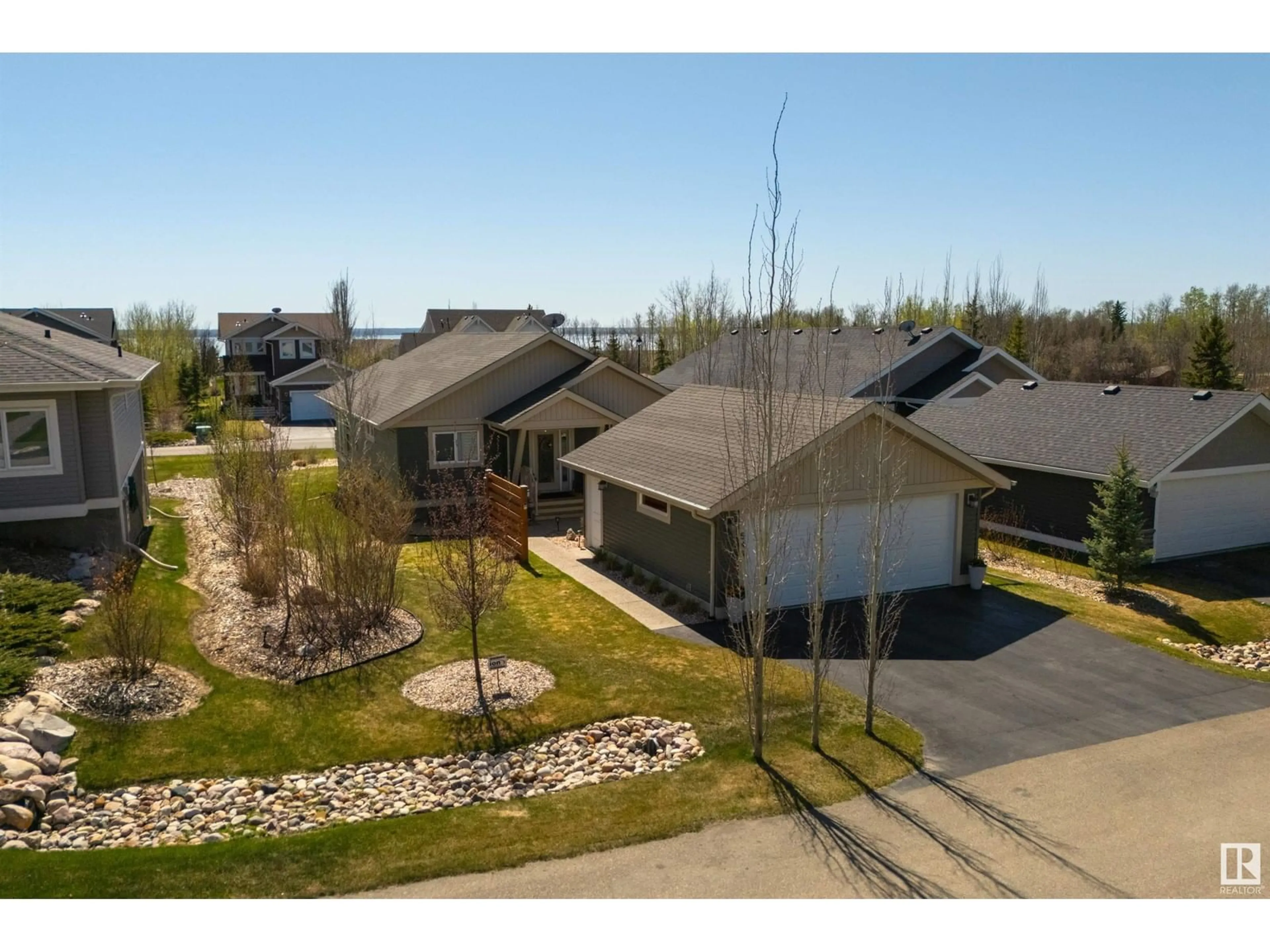 A pic from outside/outdoor area/front of a property/back of a property/a pic from drone, street for 548 55101 STE. ANNE TR, Rural Lac Ste. Anne County Alberta T0E1A1