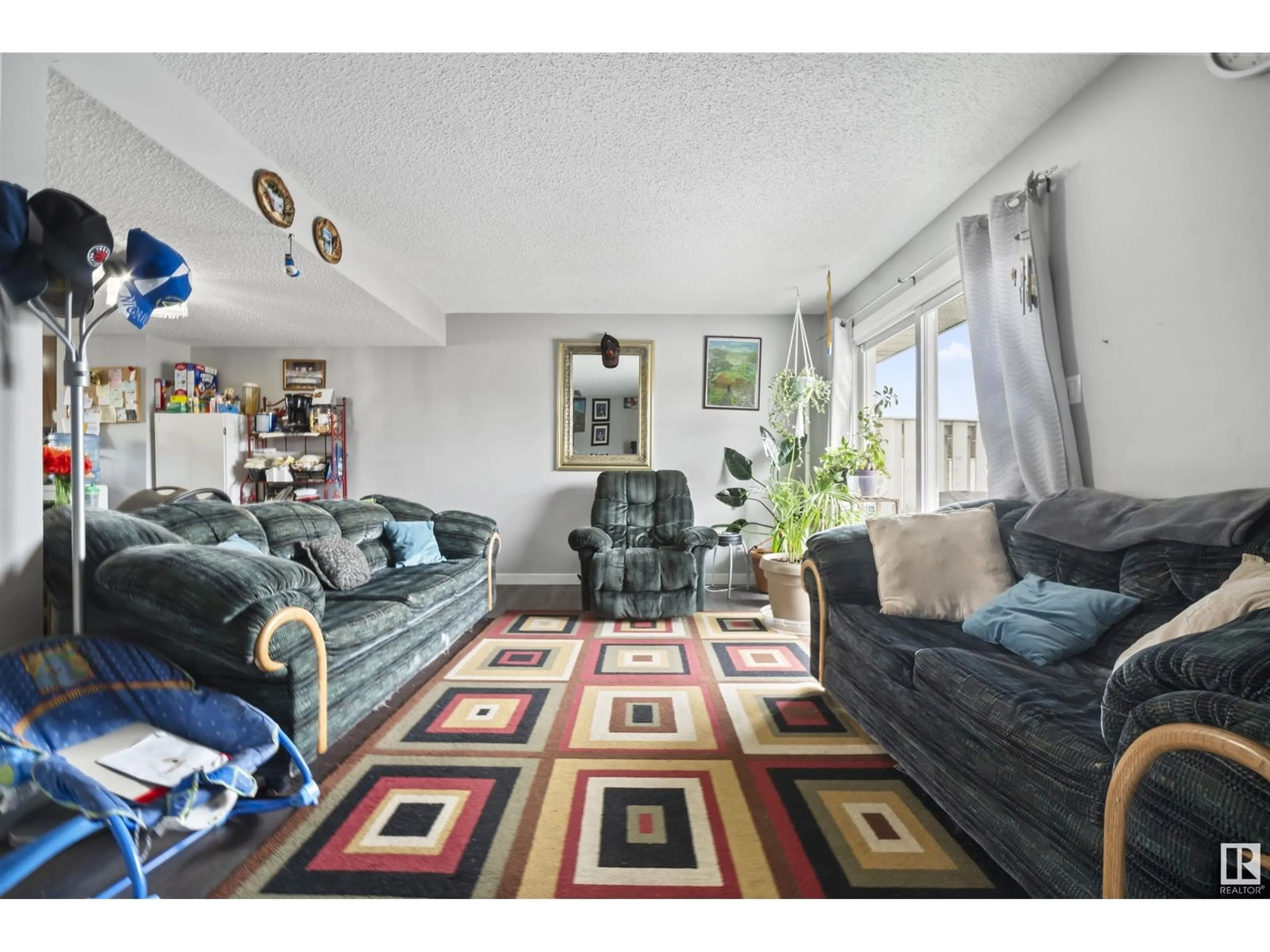 Living room with furniture, unknown for 100 - 67 16567 ST, Edmonton Alberta T5X5H4