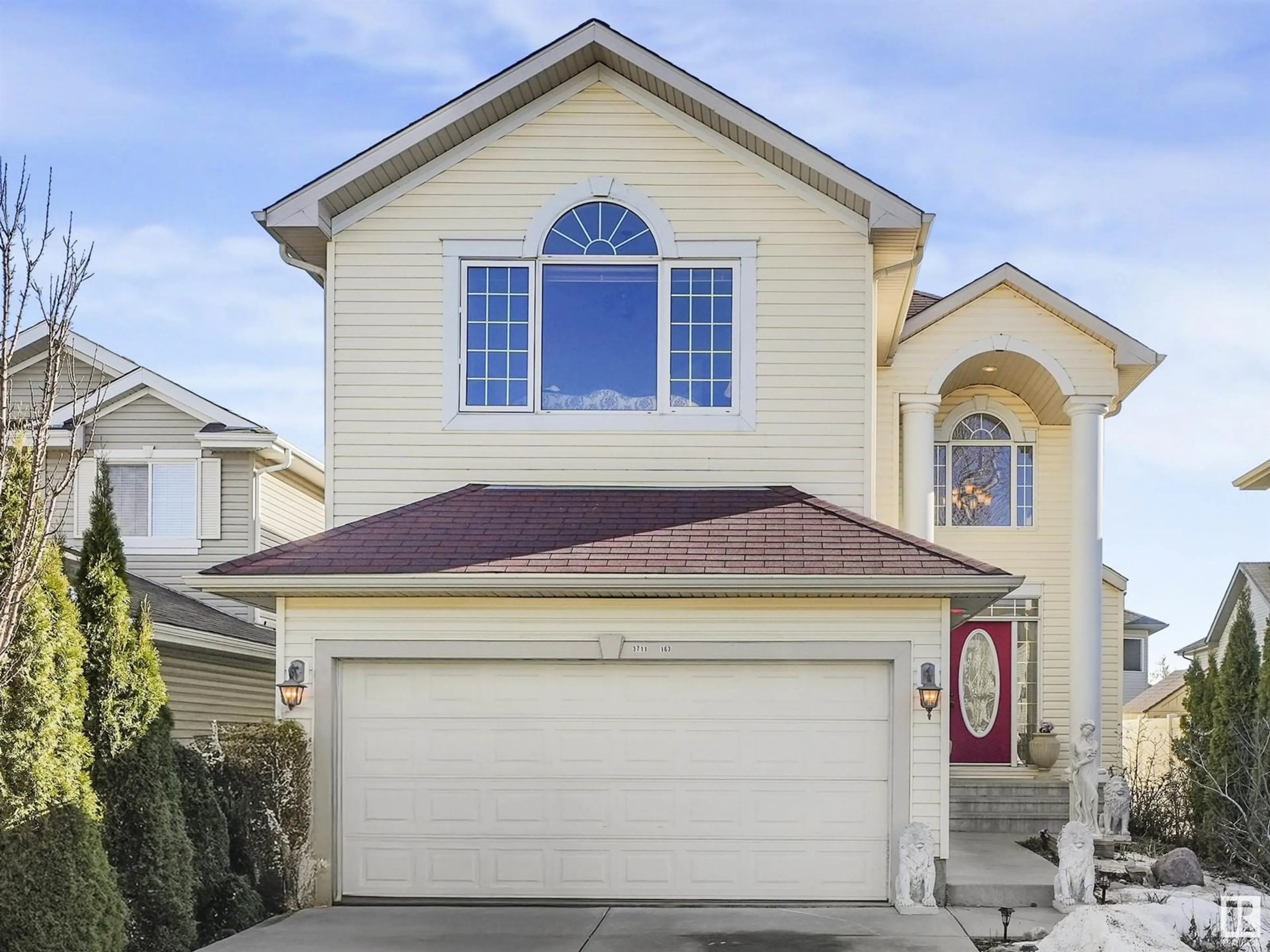 Home with vinyl exterior material, street for 3711 163 AV, Edmonton Alberta T5Y0H9