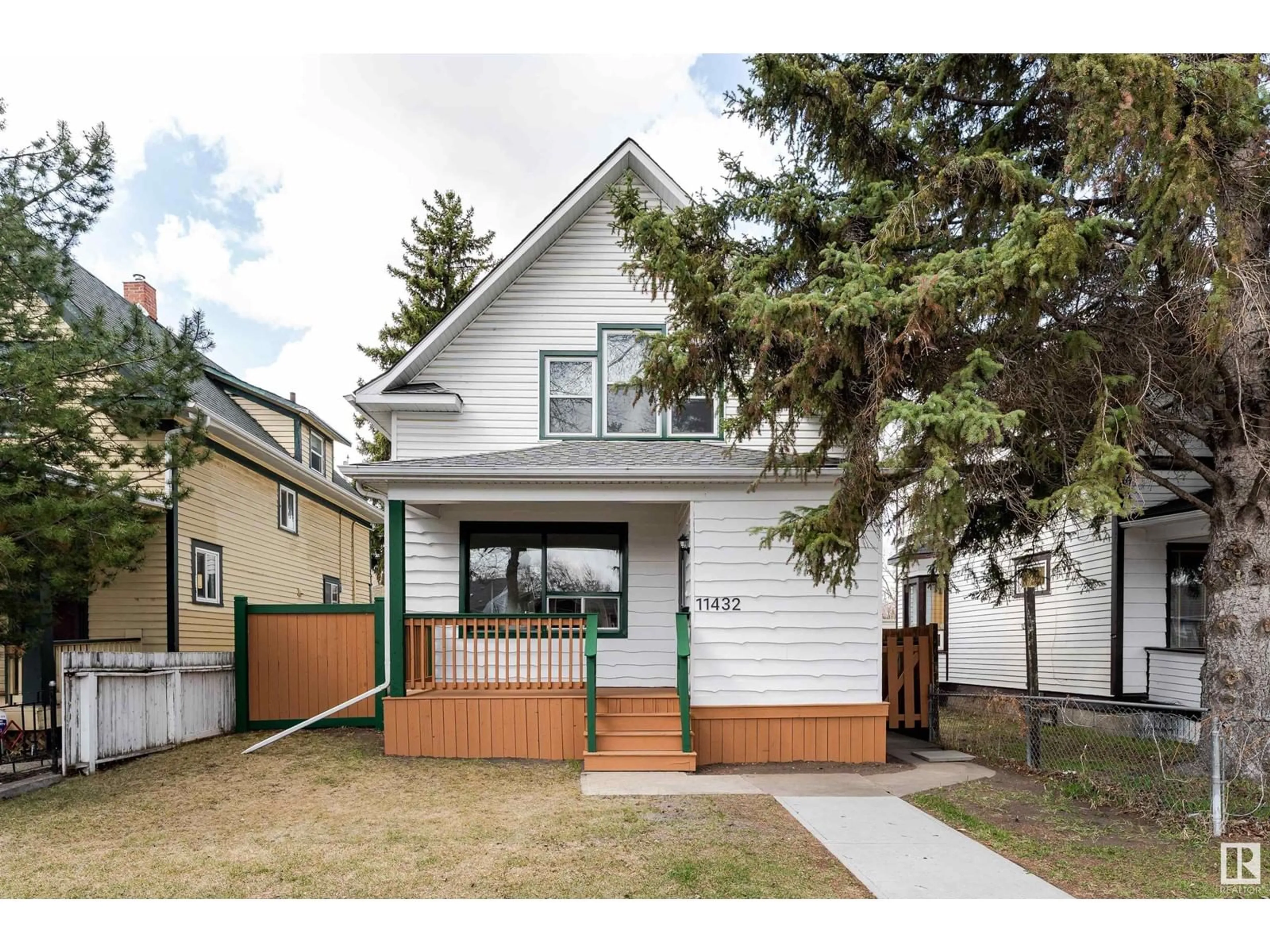 Home with vinyl exterior material, street for NW - 11432 93 ST, Edmonton Alberta T5G1C4