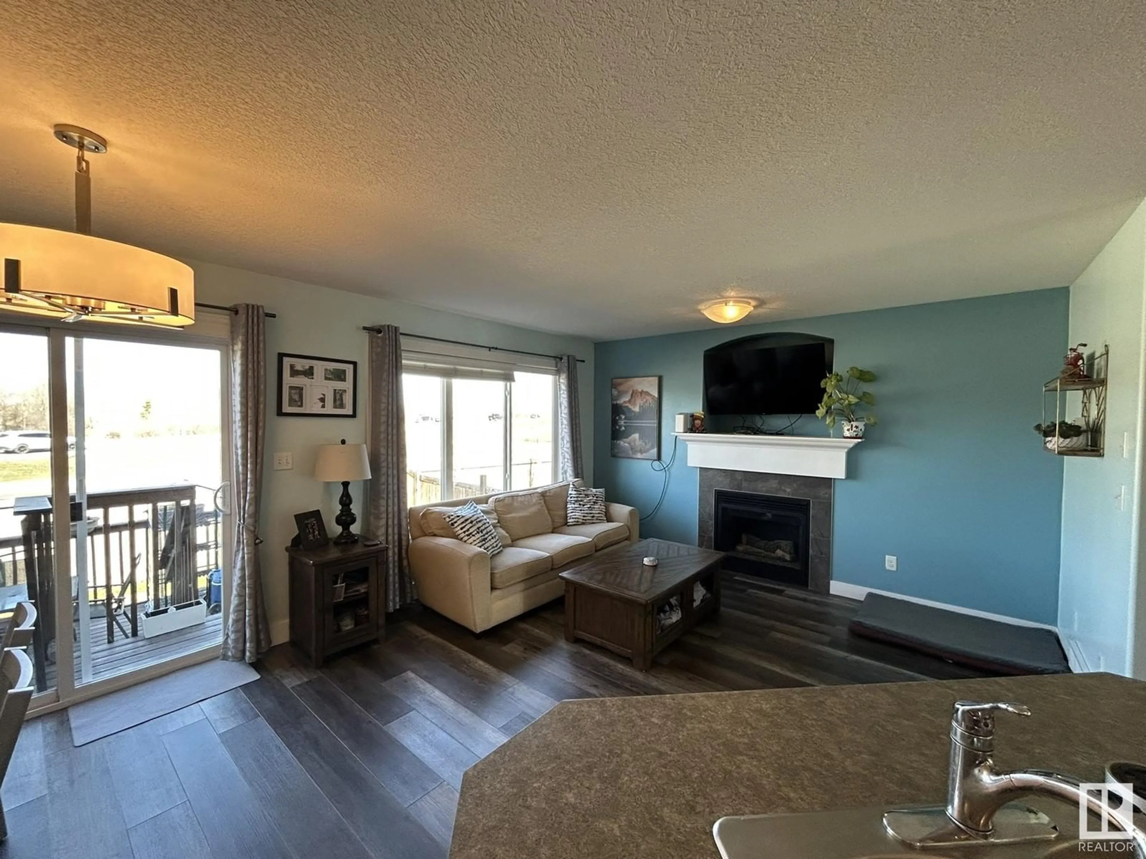Living room with furniture, wood/laminate floor for 64 MERIDIAN LO, Stony Plain Alberta T7Z0B8
