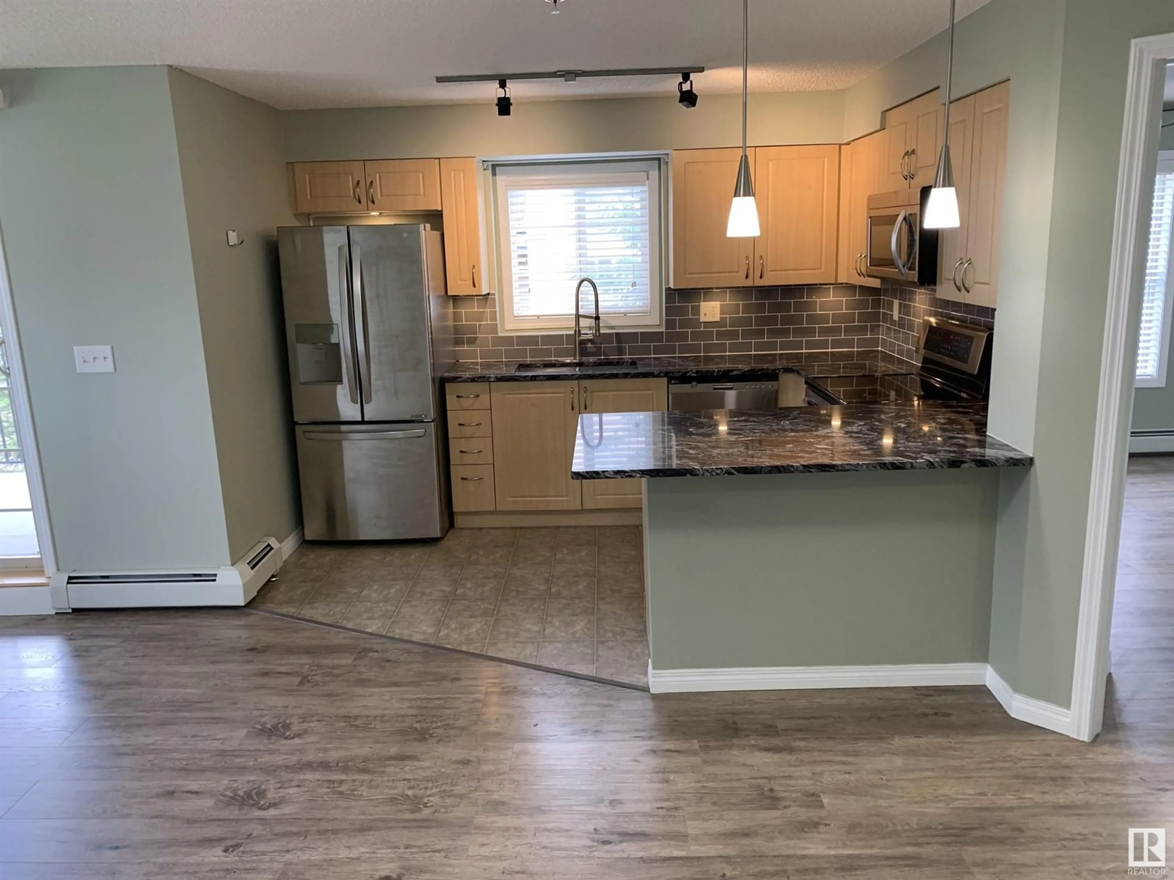 Open concept kitchen, unknown for 201 - 11449 ELLERSLIE RD, Edmonton Alberta T6W1T2