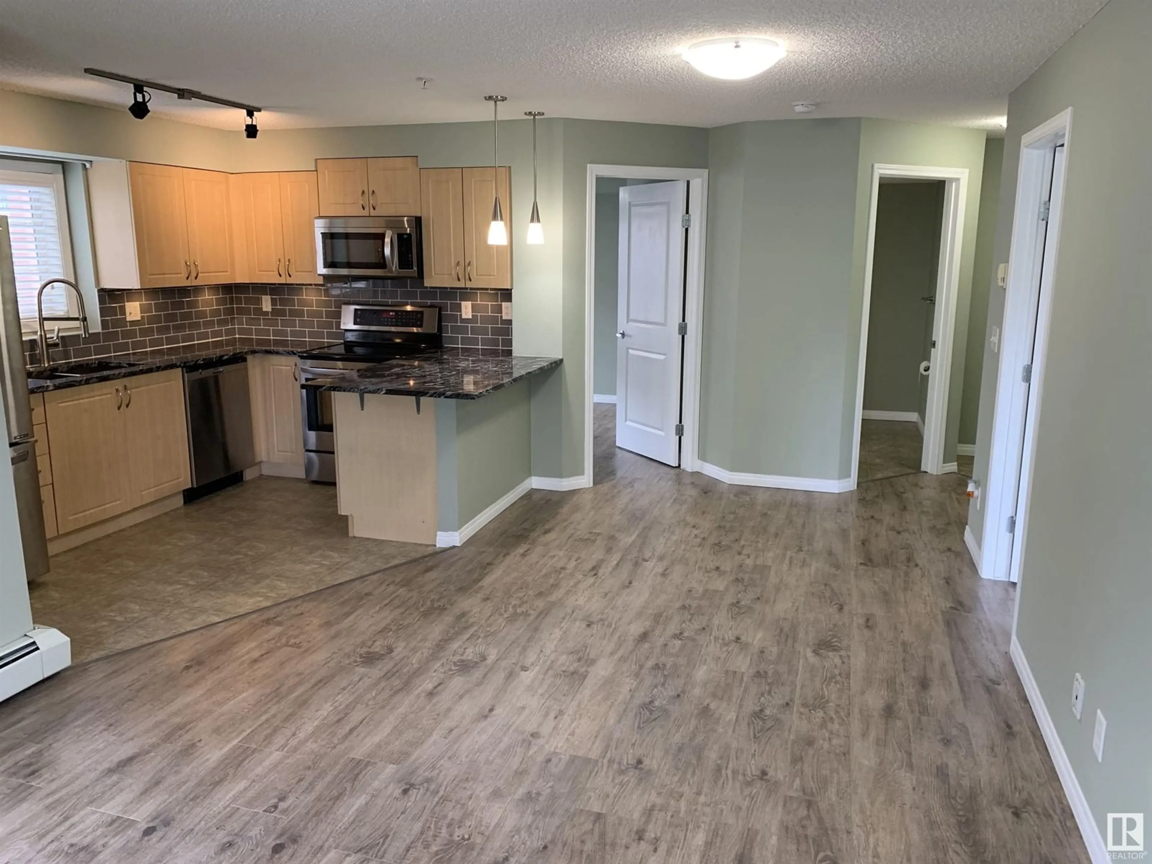 Open concept kitchen, unknown for 201 - 11449 ELLERSLIE RD, Edmonton Alberta T6W1T2