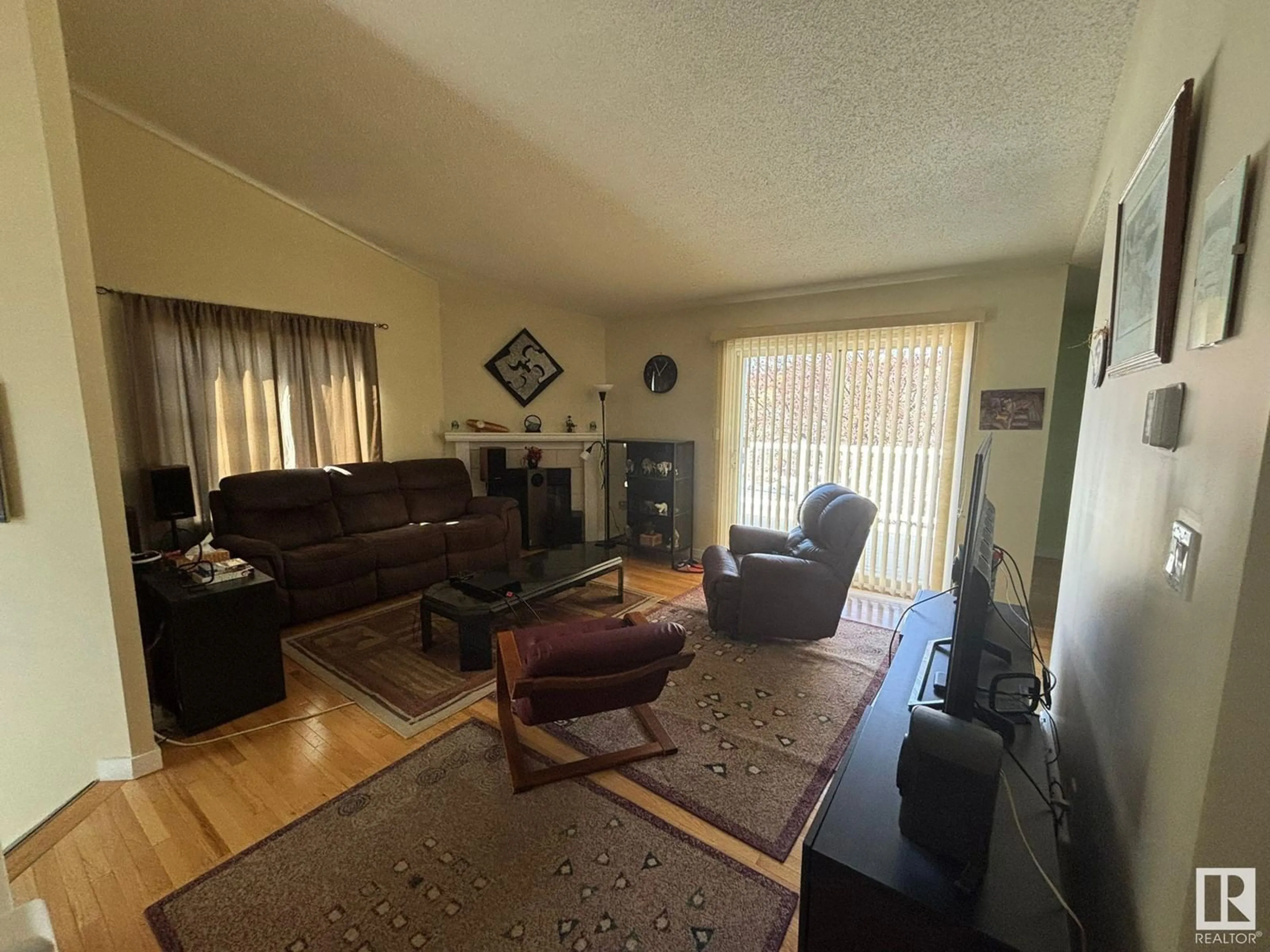 Living room with furniture, unknown for 11243 12 AV, Edmonton Alberta T6J6V6