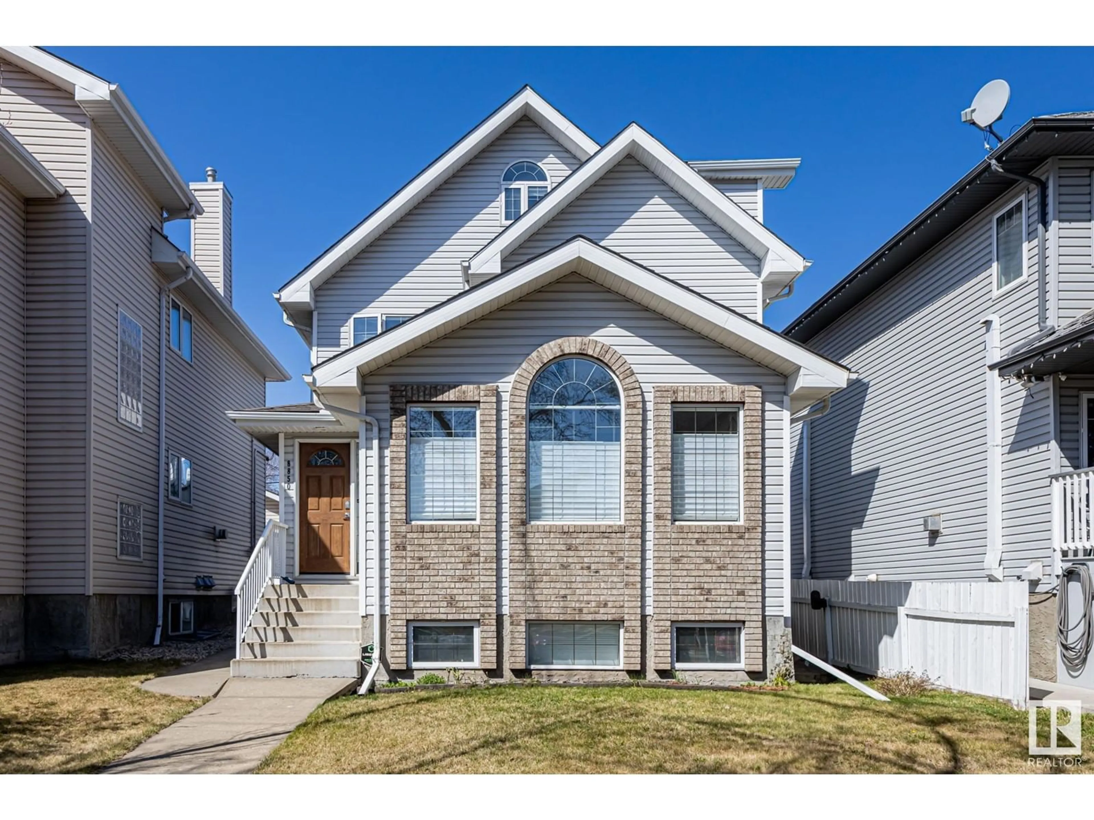 Home with brick exterior material, street for 8850 92 ST, Edmonton Alberta T6C3R1