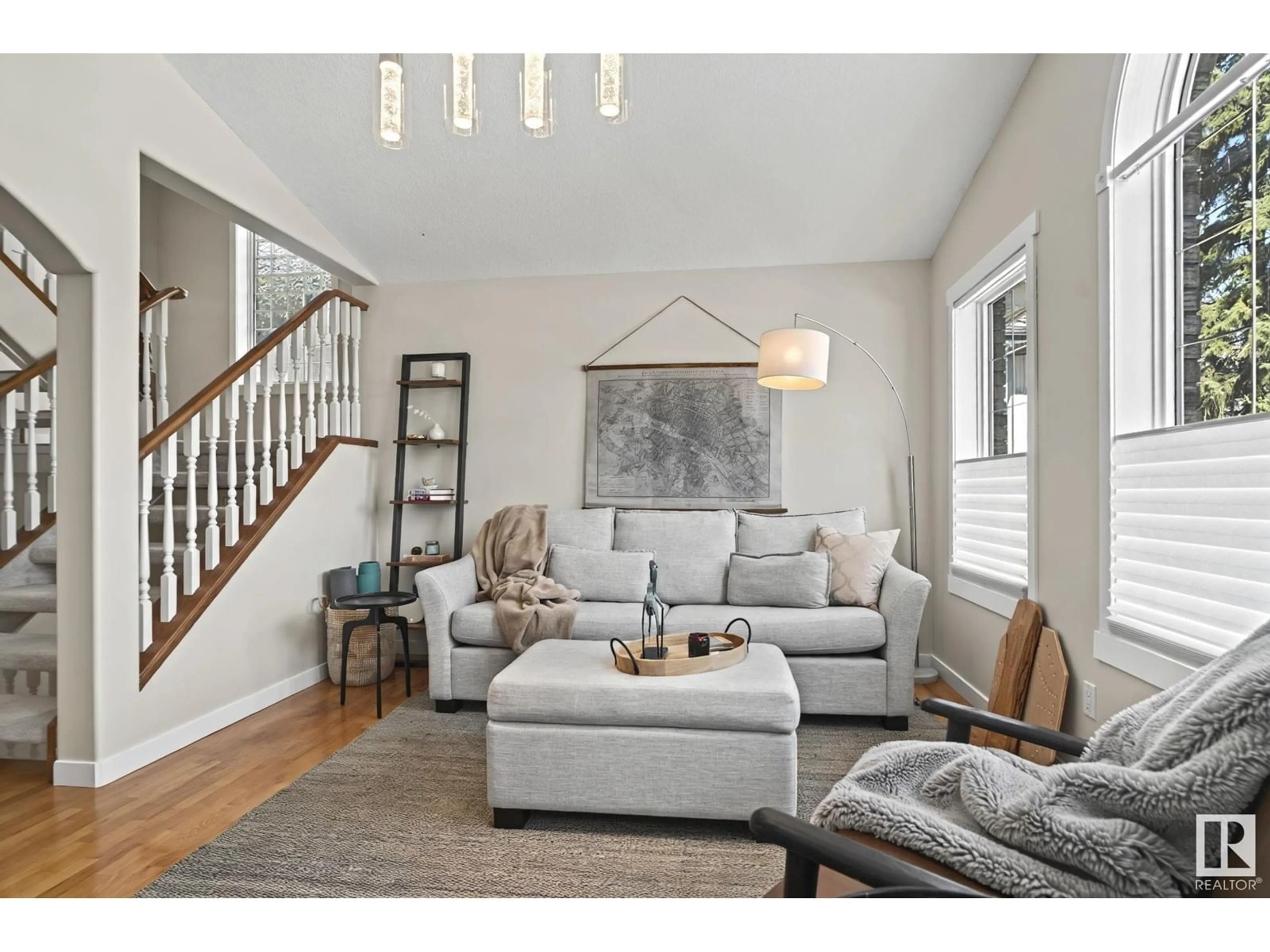 Living room with furniture, wood/laminate floor for 8850 92 ST, Edmonton Alberta T6C3R1