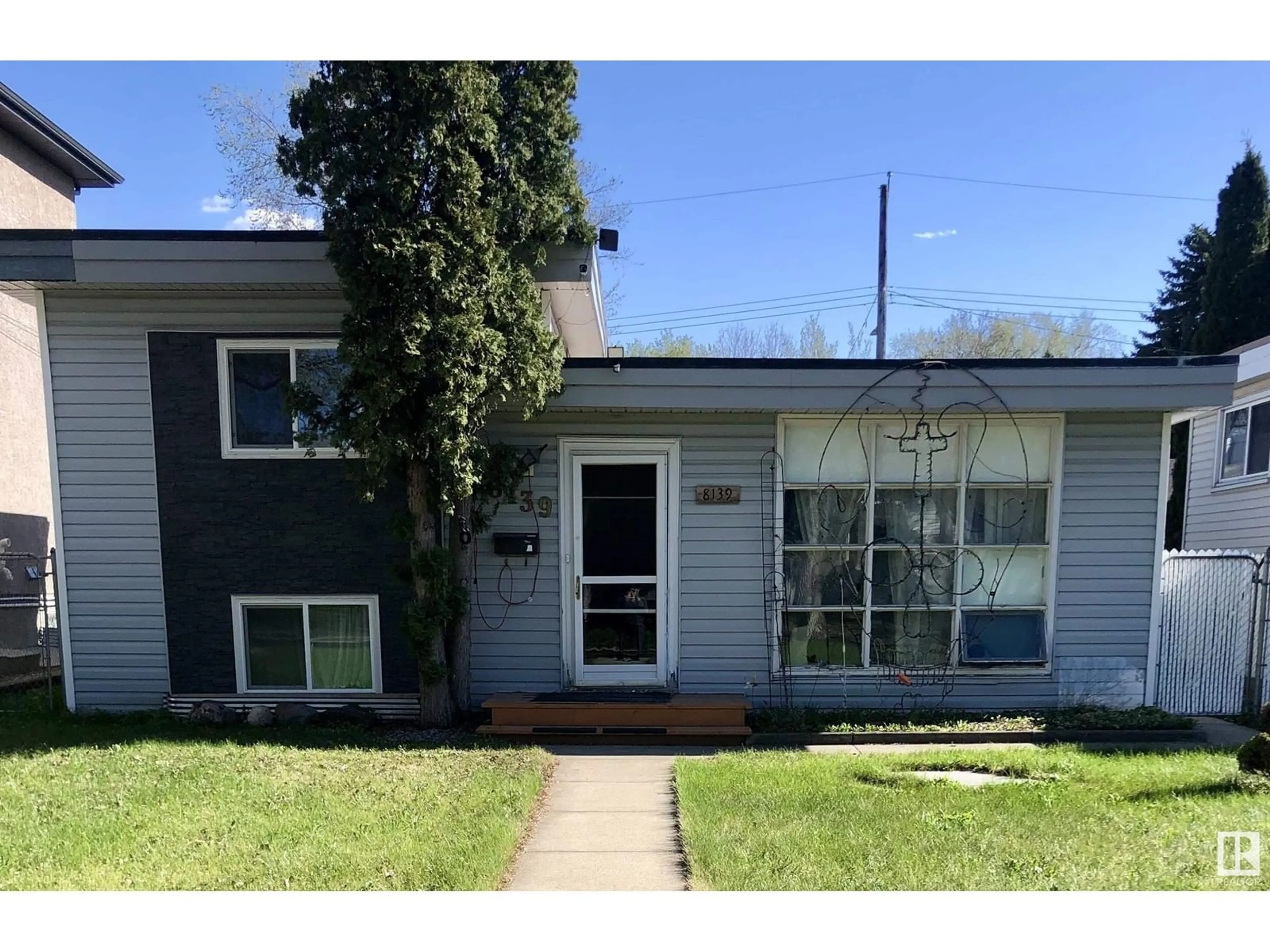 Home with vinyl exterior material, street for NW - 8139 81 AV, Edmonton Alberta T6C0V8
