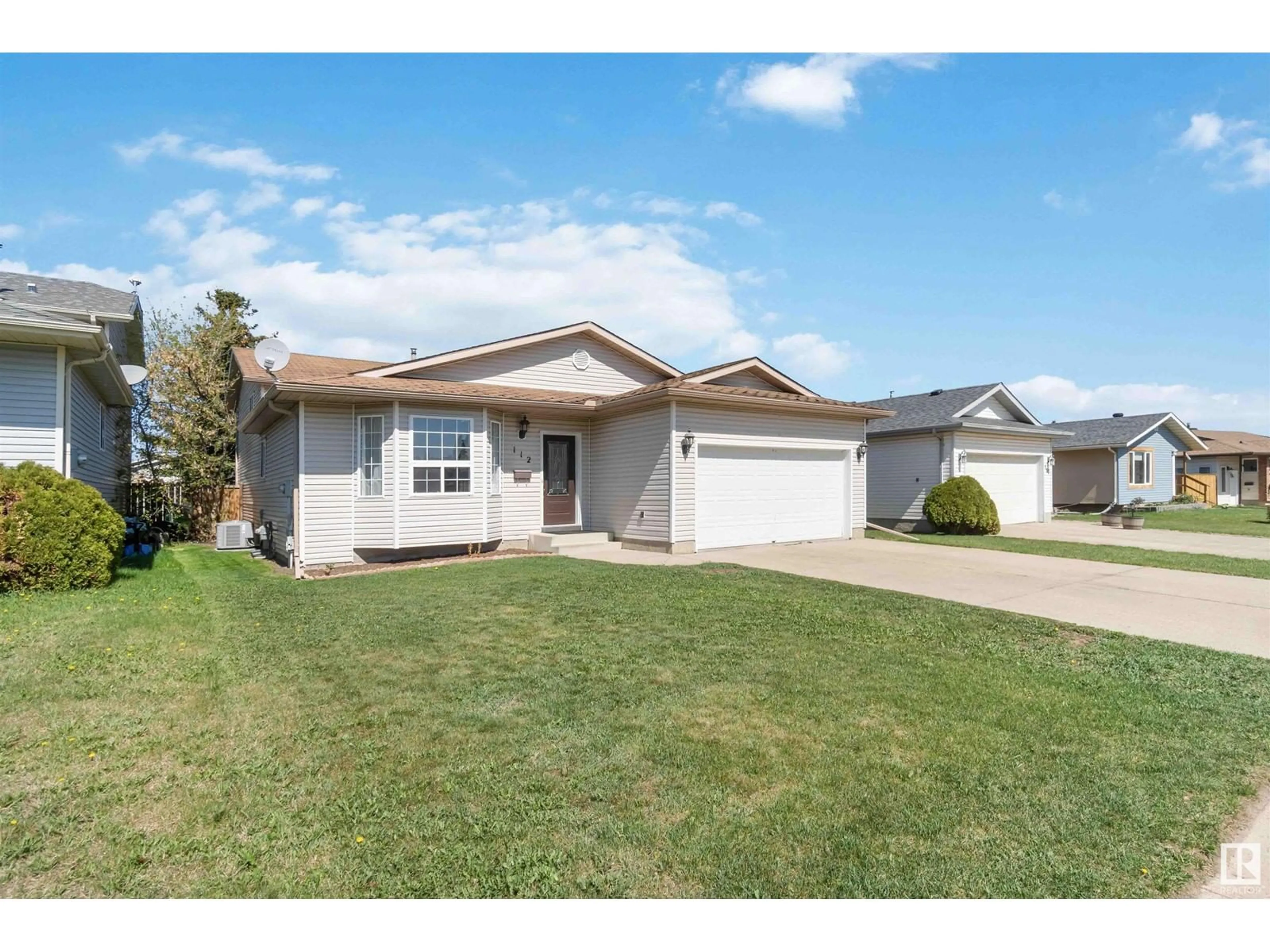 Home with vinyl exterior material, street for 112 LUNNON DR, Gibbons Alberta T0A1N0