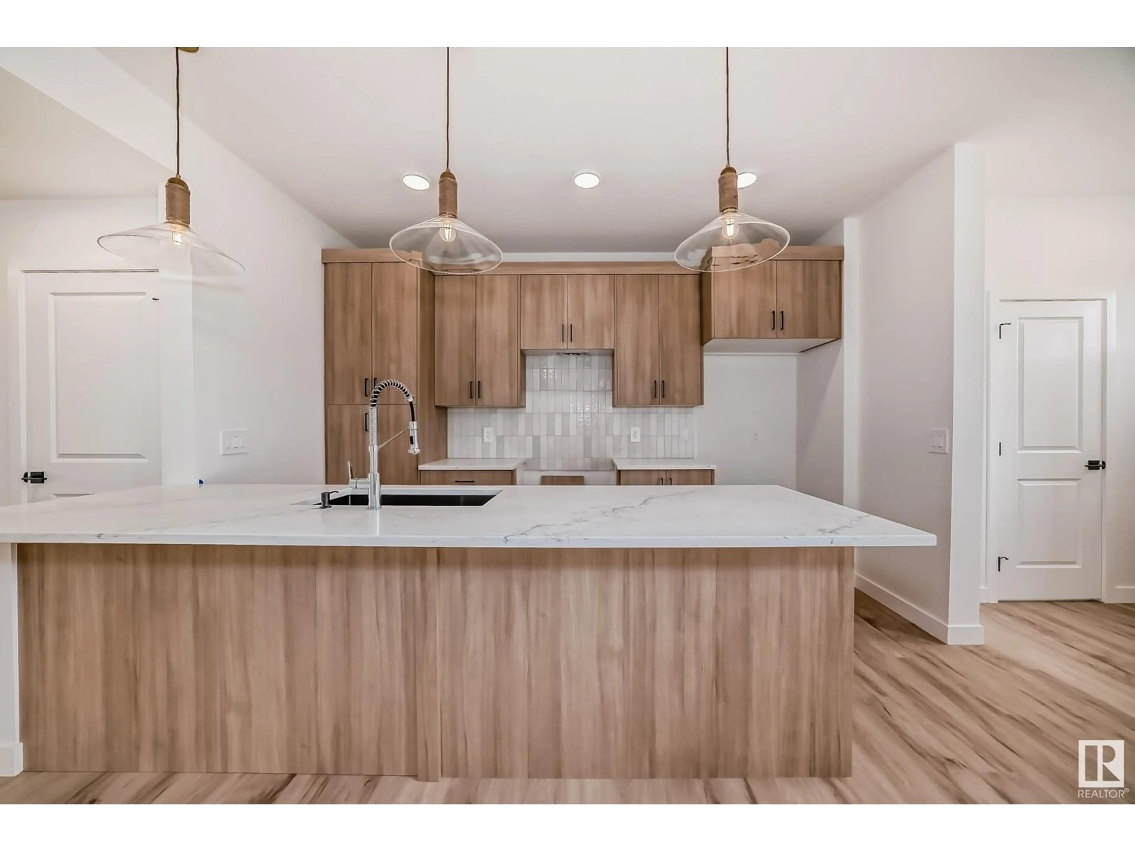 Open concept kitchen, wood/laminate floor for 1338 KESWICK DR, Edmonton Alberta T6W4V8