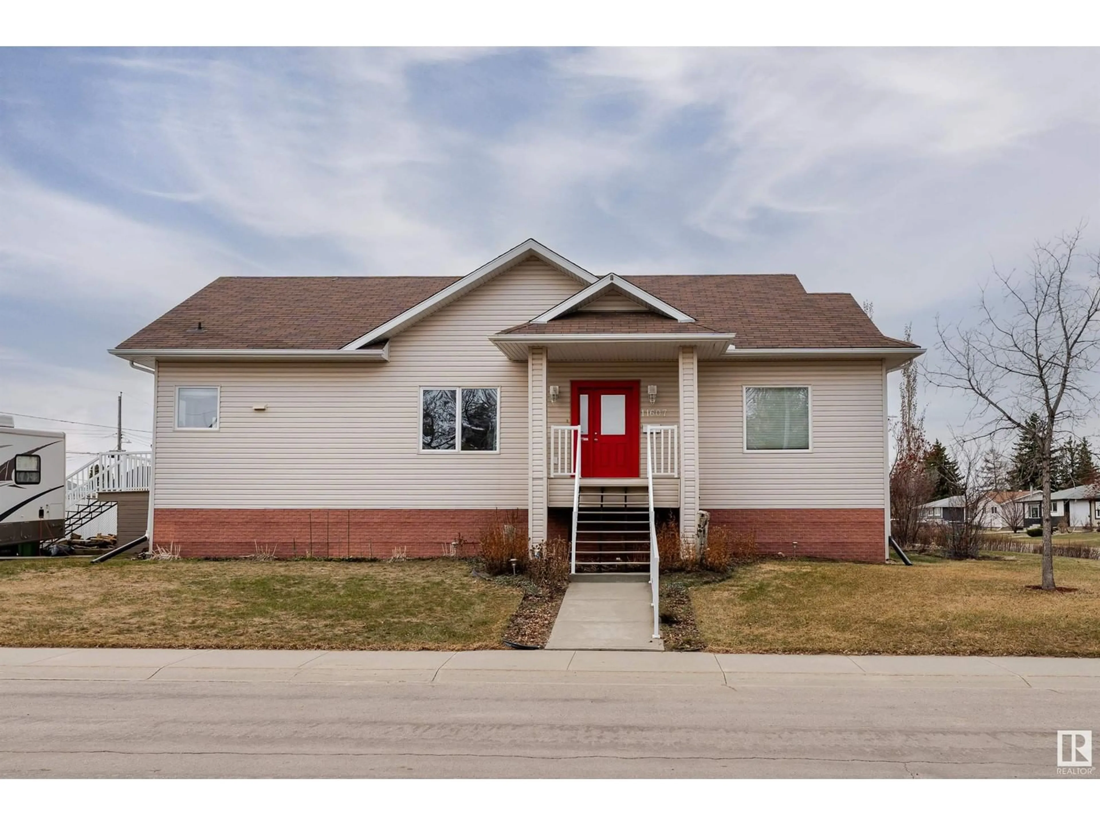 Home with brick exterior material, street for NW - 11607 135A AV, Edmonton Alberta T5E1T3