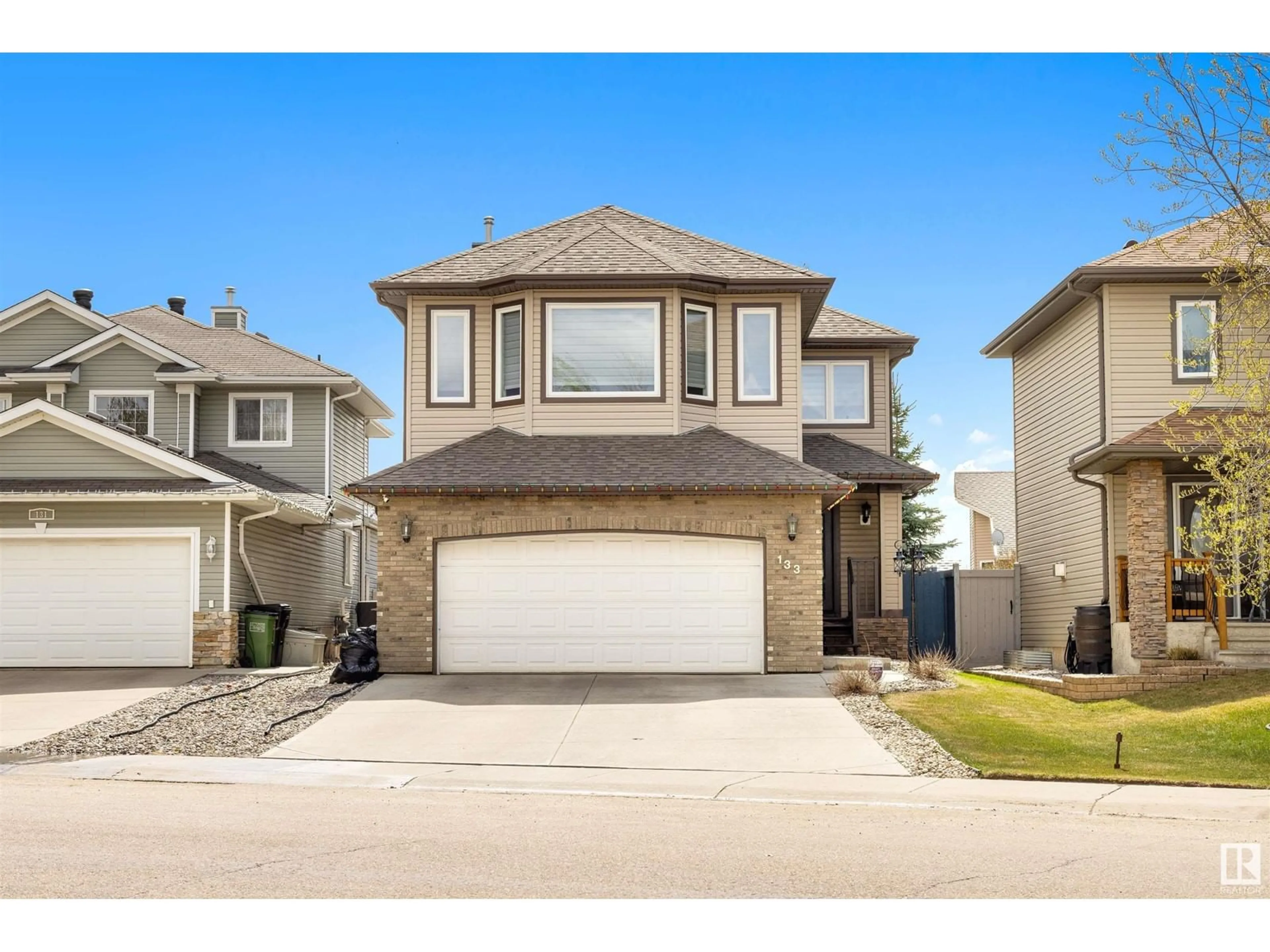 Home with vinyl exterior material, street for 133 CASTLE DR, Edmonton Alberta T5X6J1