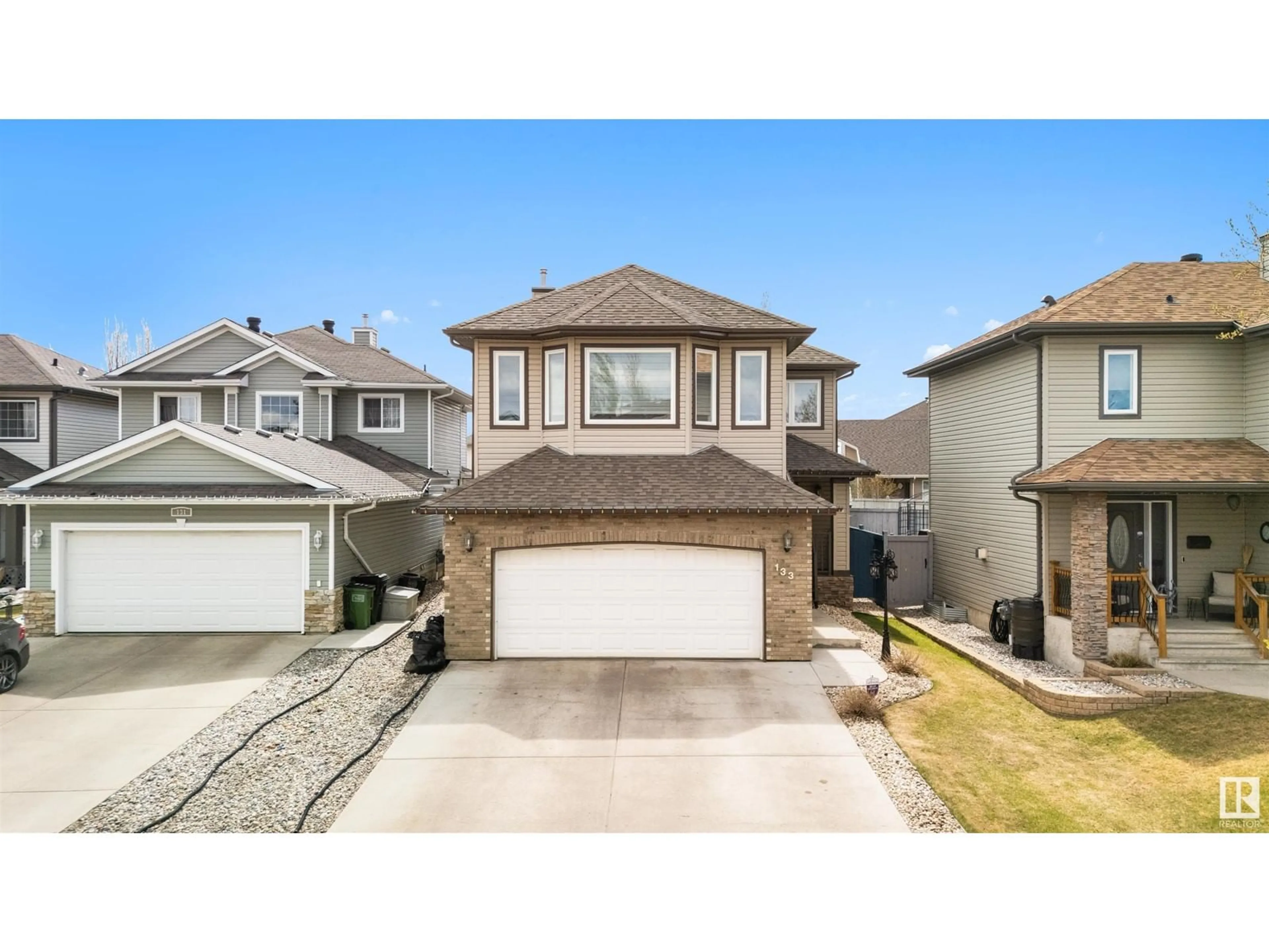 Home with vinyl exterior material, street for 133 CASTLE DR, Edmonton Alberta T5X6J1