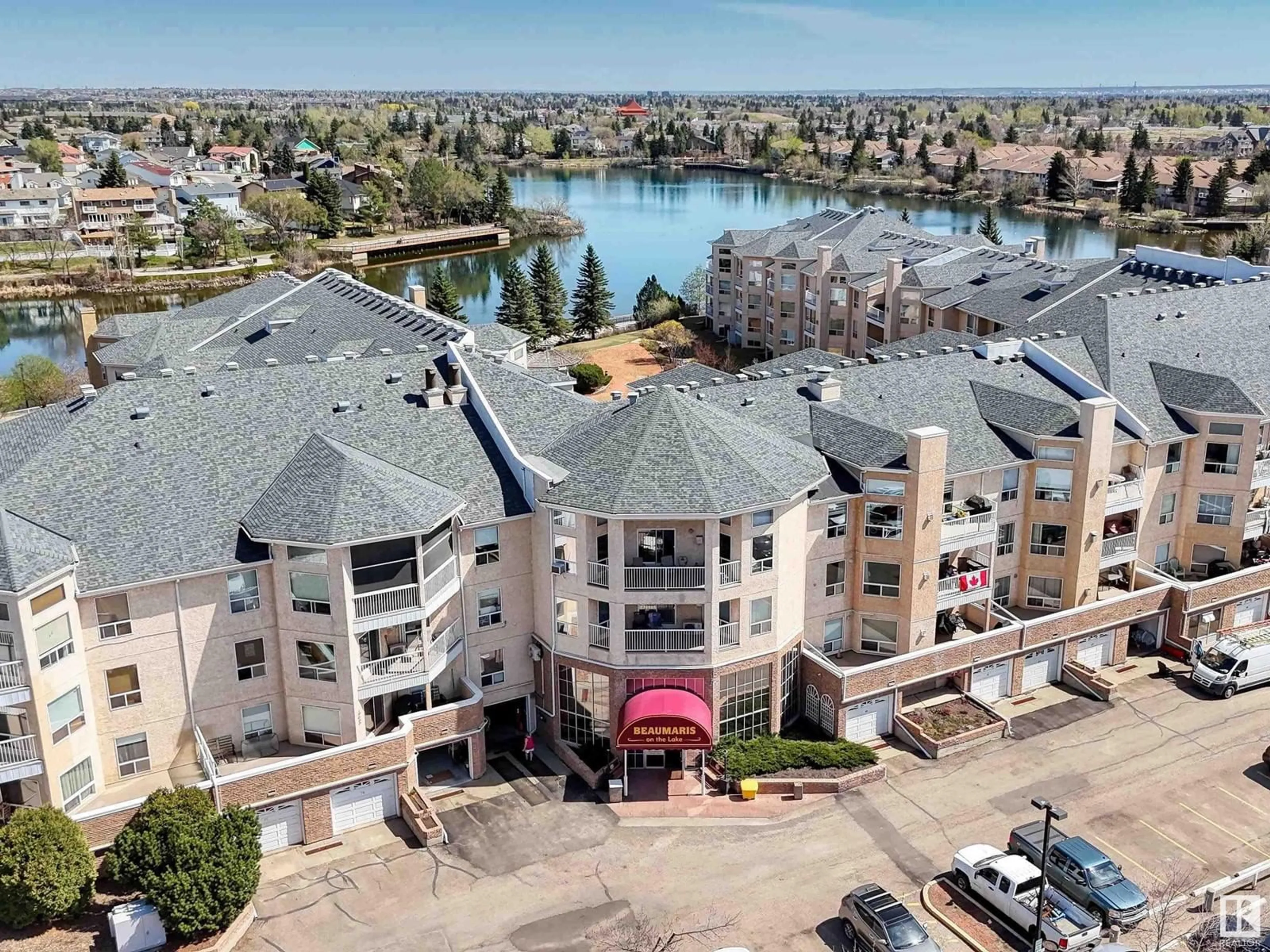 A pic from outside/outdoor area/front of a property/back of a property/a pic from drone, water/lake/river/ocean view for #407 - 15499 CASTLE DOWNS RD, Edmonton Alberta T5X5Y3