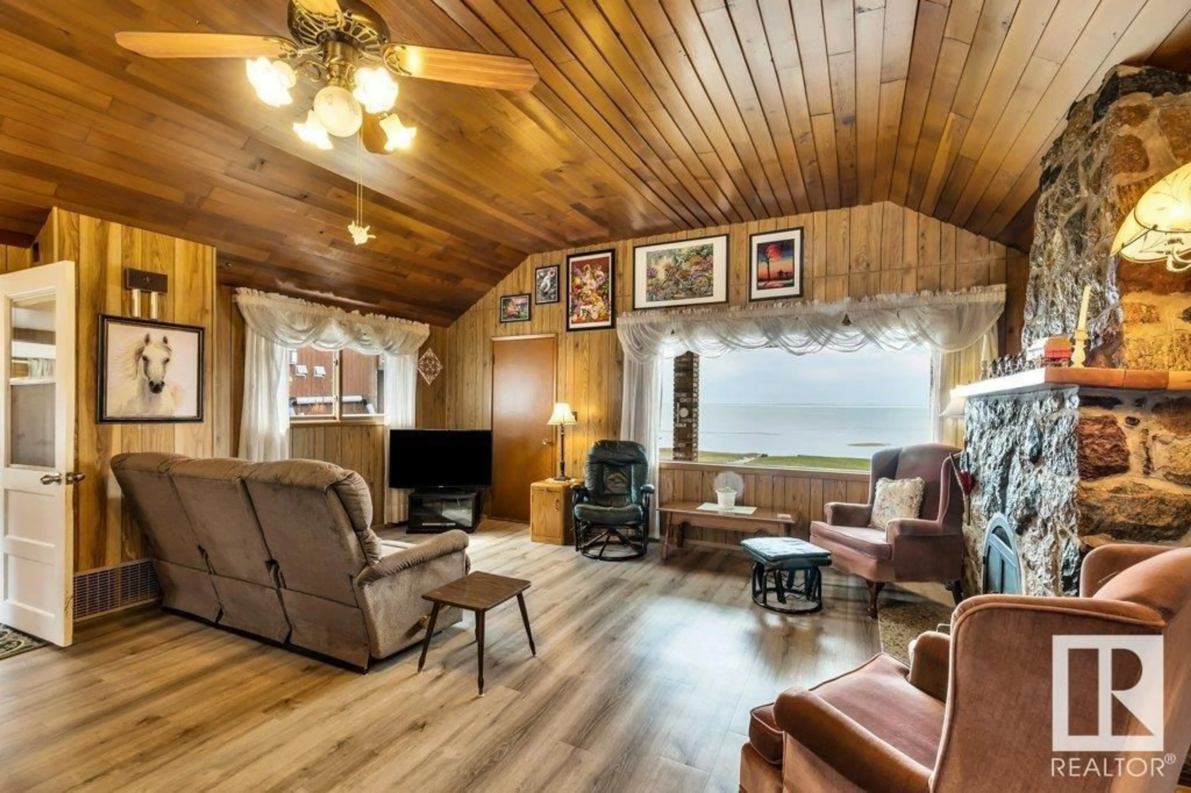 Living room with furniture, wood/laminate floor for 907 1ST AVE, Rural Wetaskiwin County Alberta T0C1X0