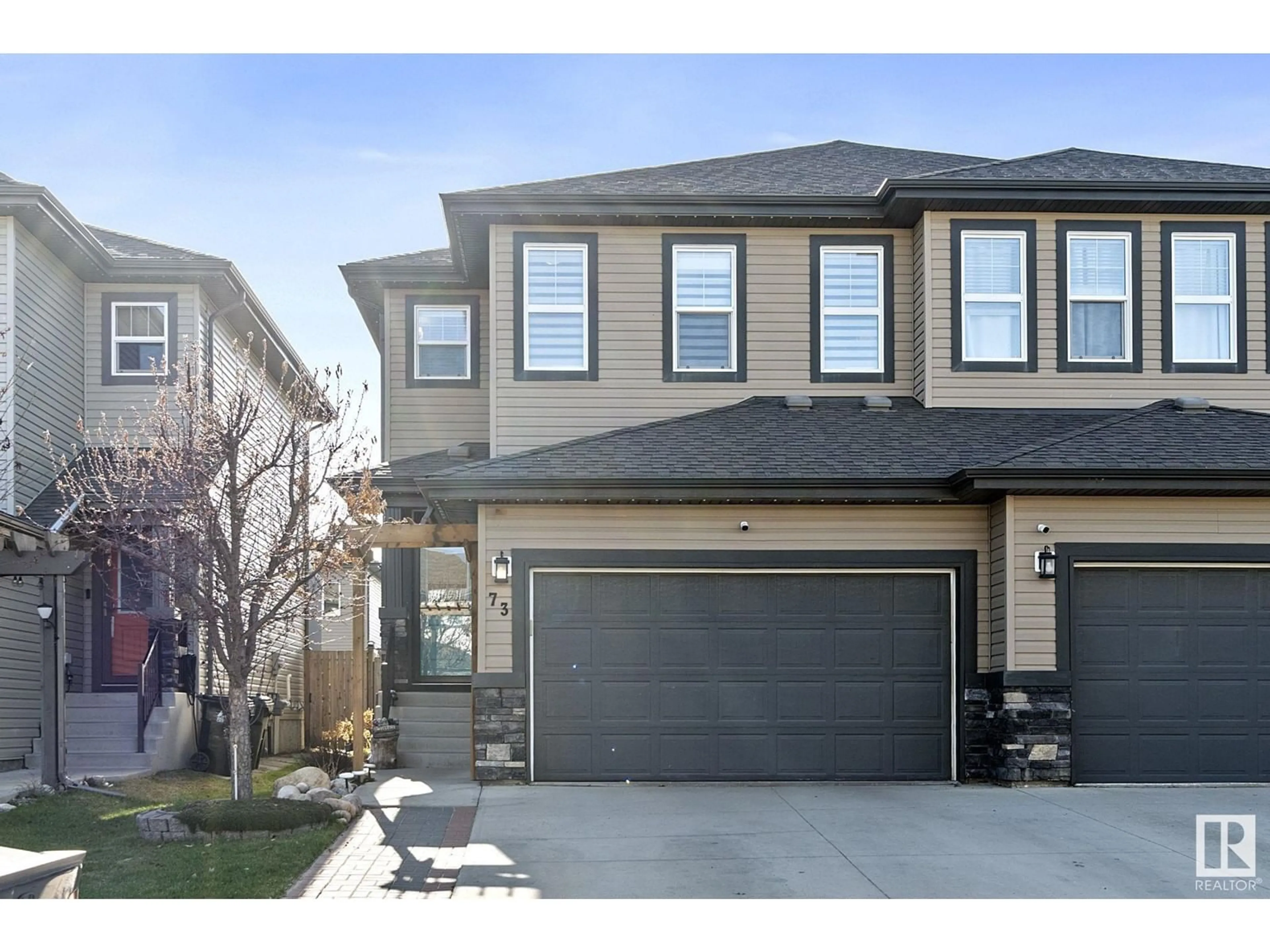 Home with vinyl exterior material, street for 73 SPRINGWOOD WY, Spruce Grove Alberta T7X0S8