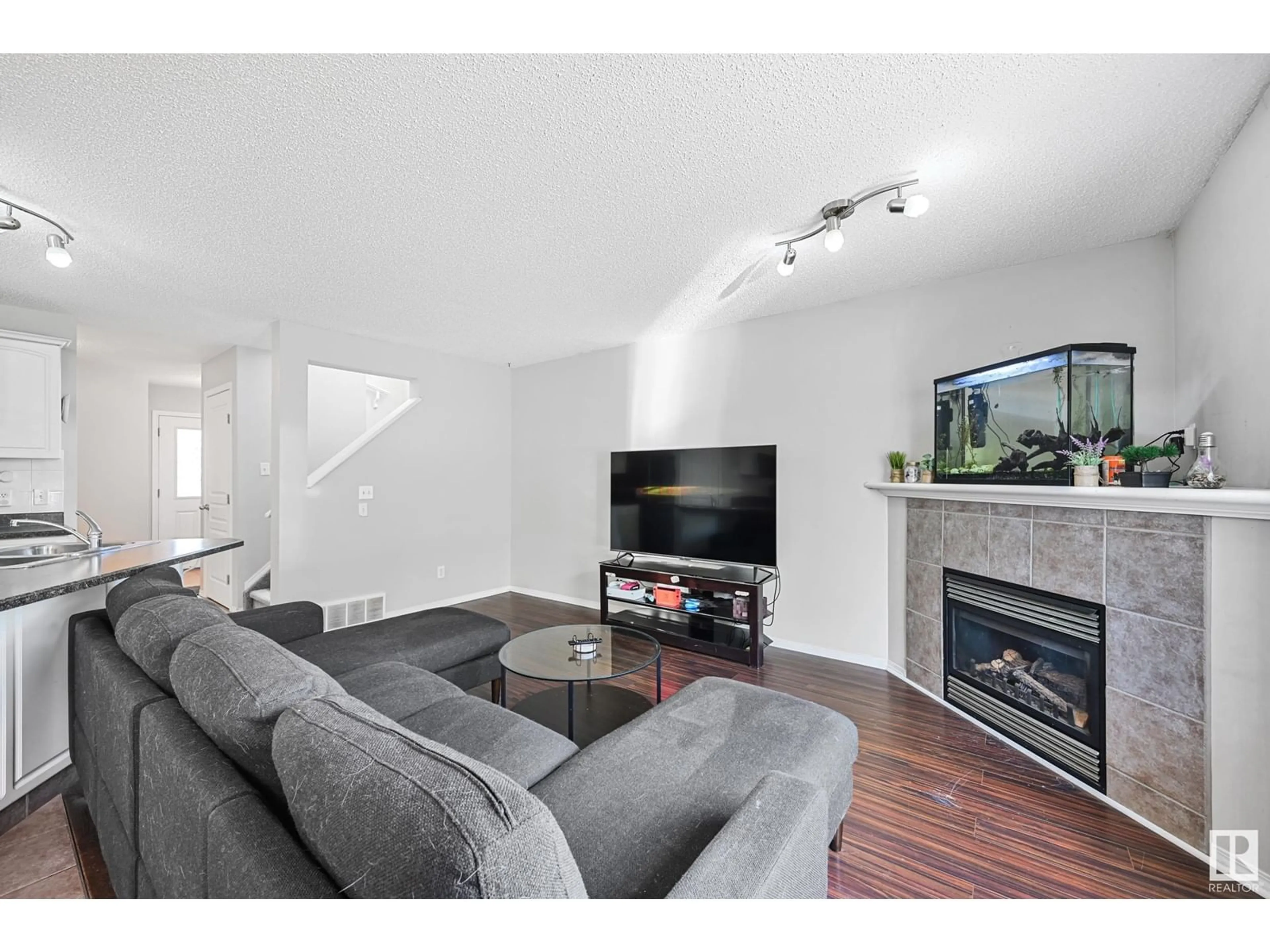 Living room with furniture, wood/laminate floor for 5305 RUE PARC ST, Beaumont Alberta T4X1W4
