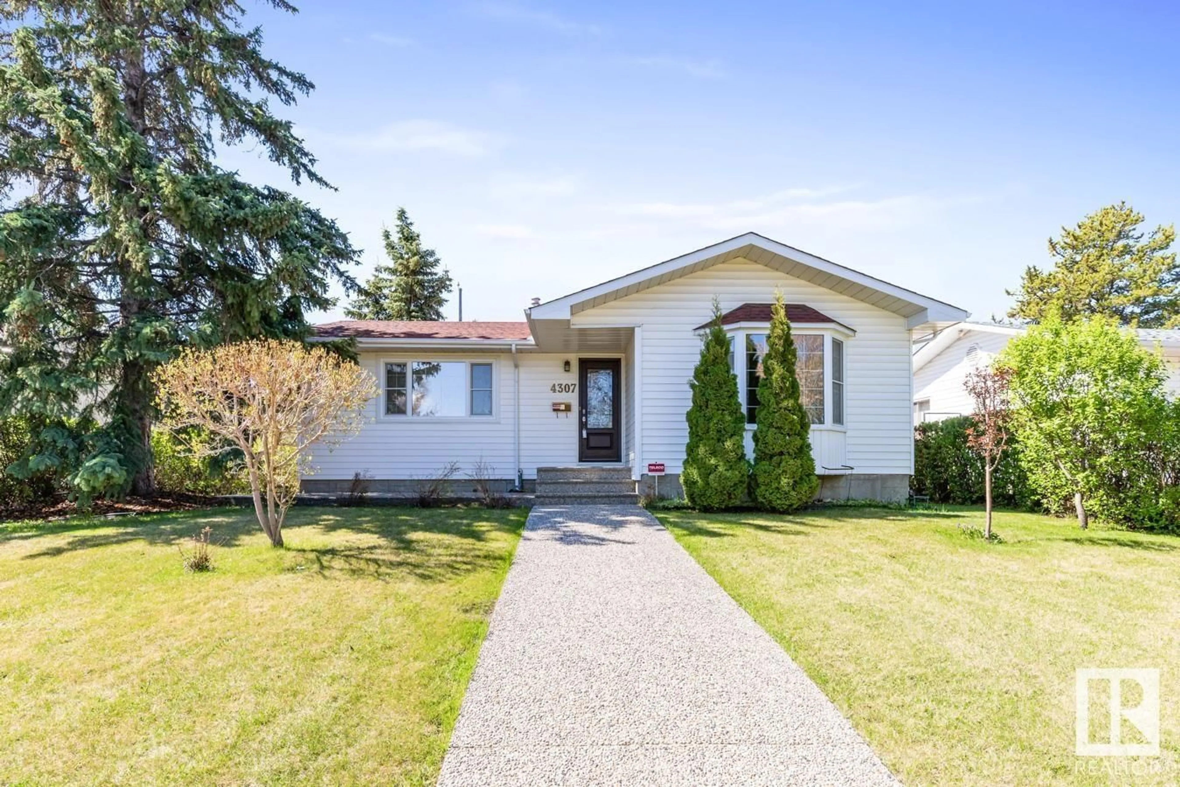 Home with vinyl exterior material, street for NW - 4307 109A AV, Edmonton Alberta T6A1S3