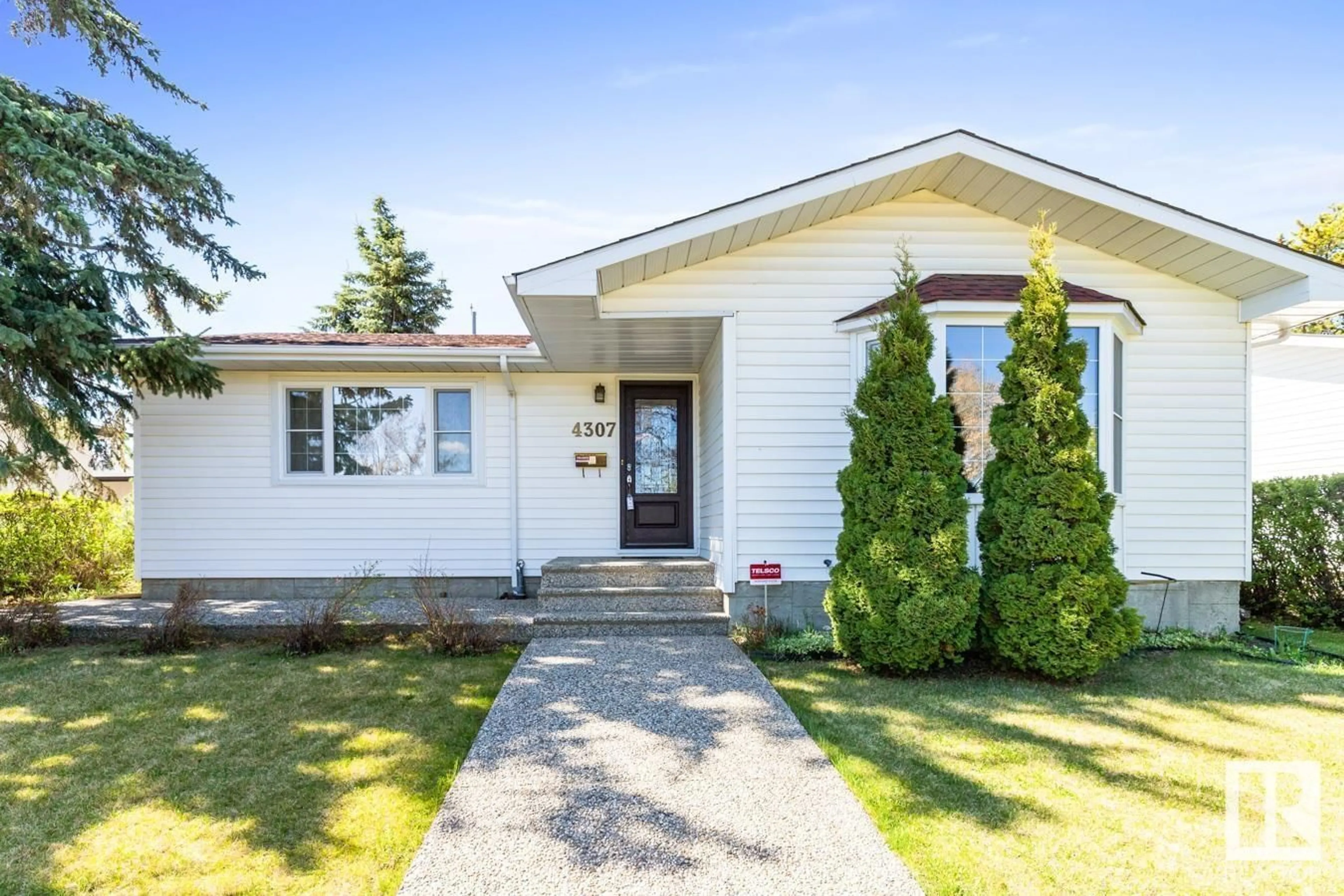 Home with vinyl exterior material, street for NW - 4307 109A AV, Edmonton Alberta T6A1S3