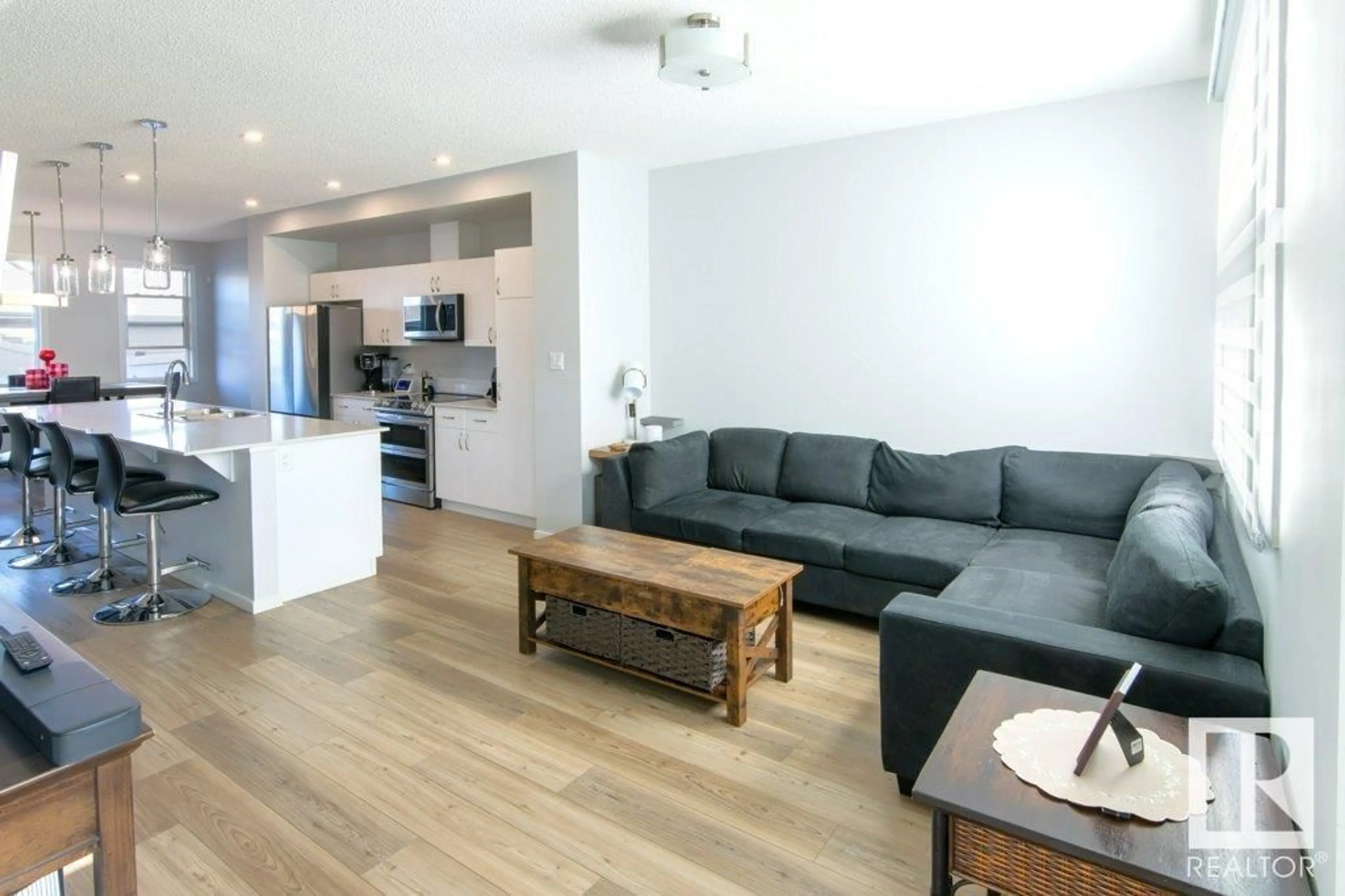 Living room with furniture, wood/laminate floor for 5313 ADMIRAL GIROUARD ST, Edmonton Alberta T5E6X5