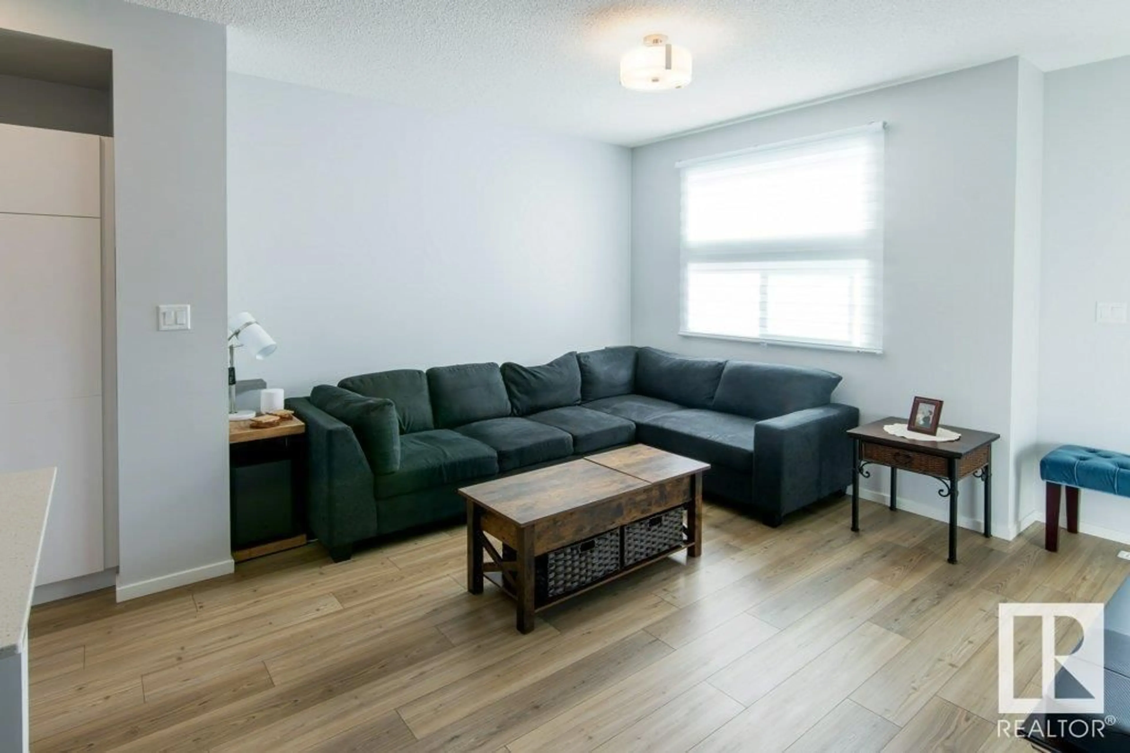 Living room with furniture, wood/laminate floor for 5313 ADMIRAL GIROUARD ST, Edmonton Alberta T5E6X5