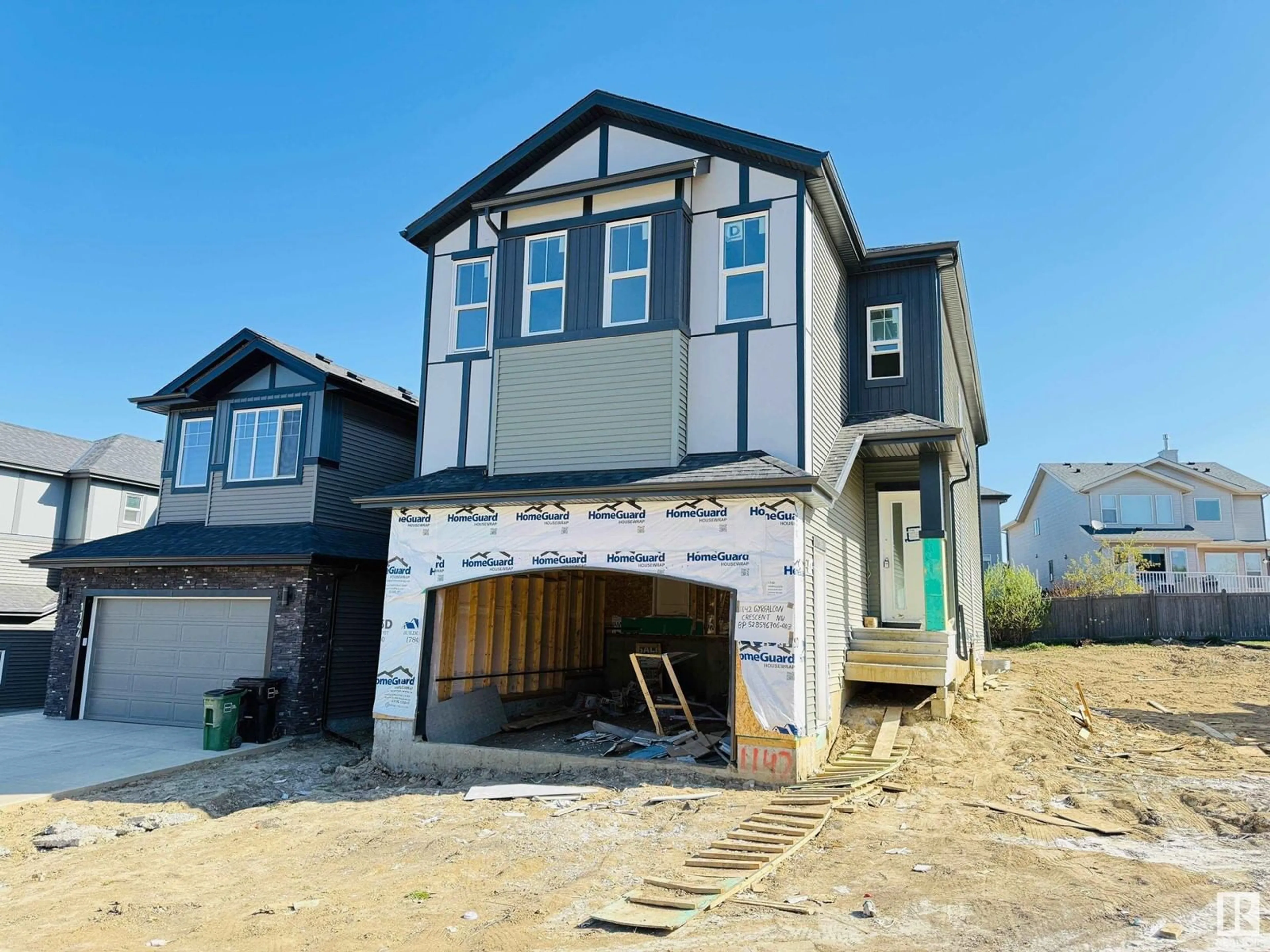 Home with vinyl exterior material, street for 1142 GYRFALCON CR, Edmonton Alberta T5S0S5