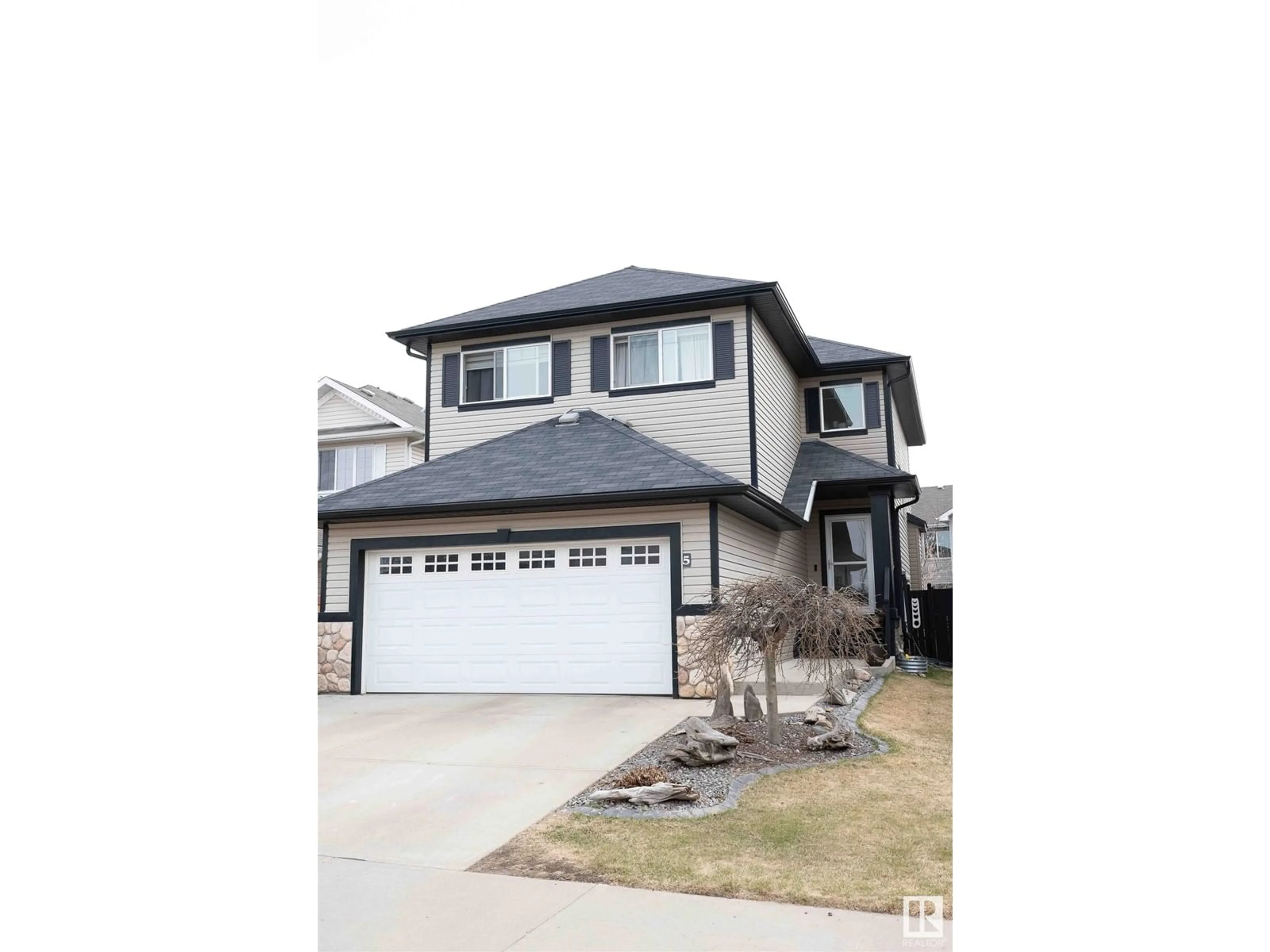 Home with vinyl exterior material, street for 5 BAIE MADELENE, Beaumont Alberta T4X0E8