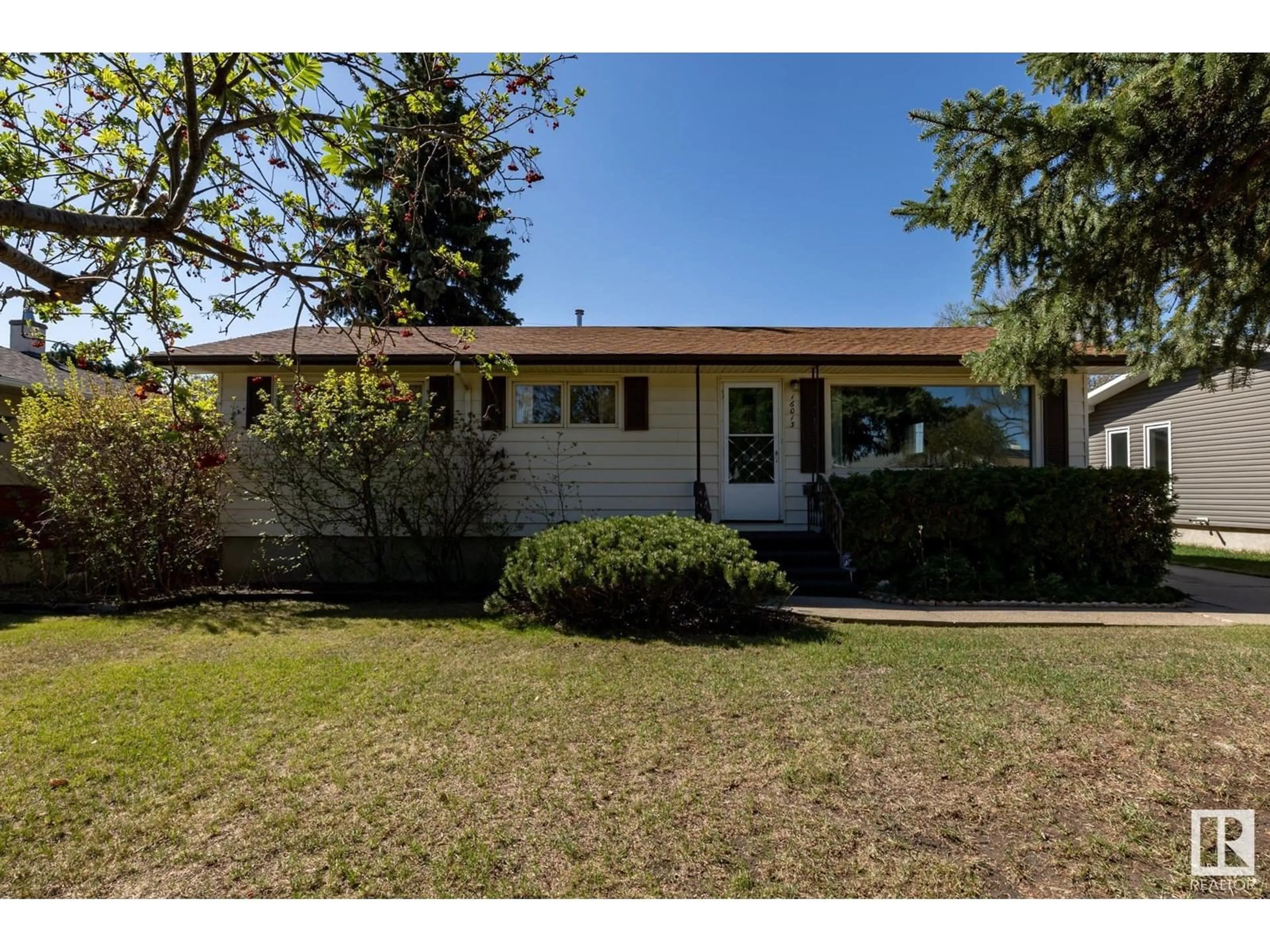 Home with vinyl exterior material, street for 16013 93A AV, Edmonton Alberta T5R5J7
