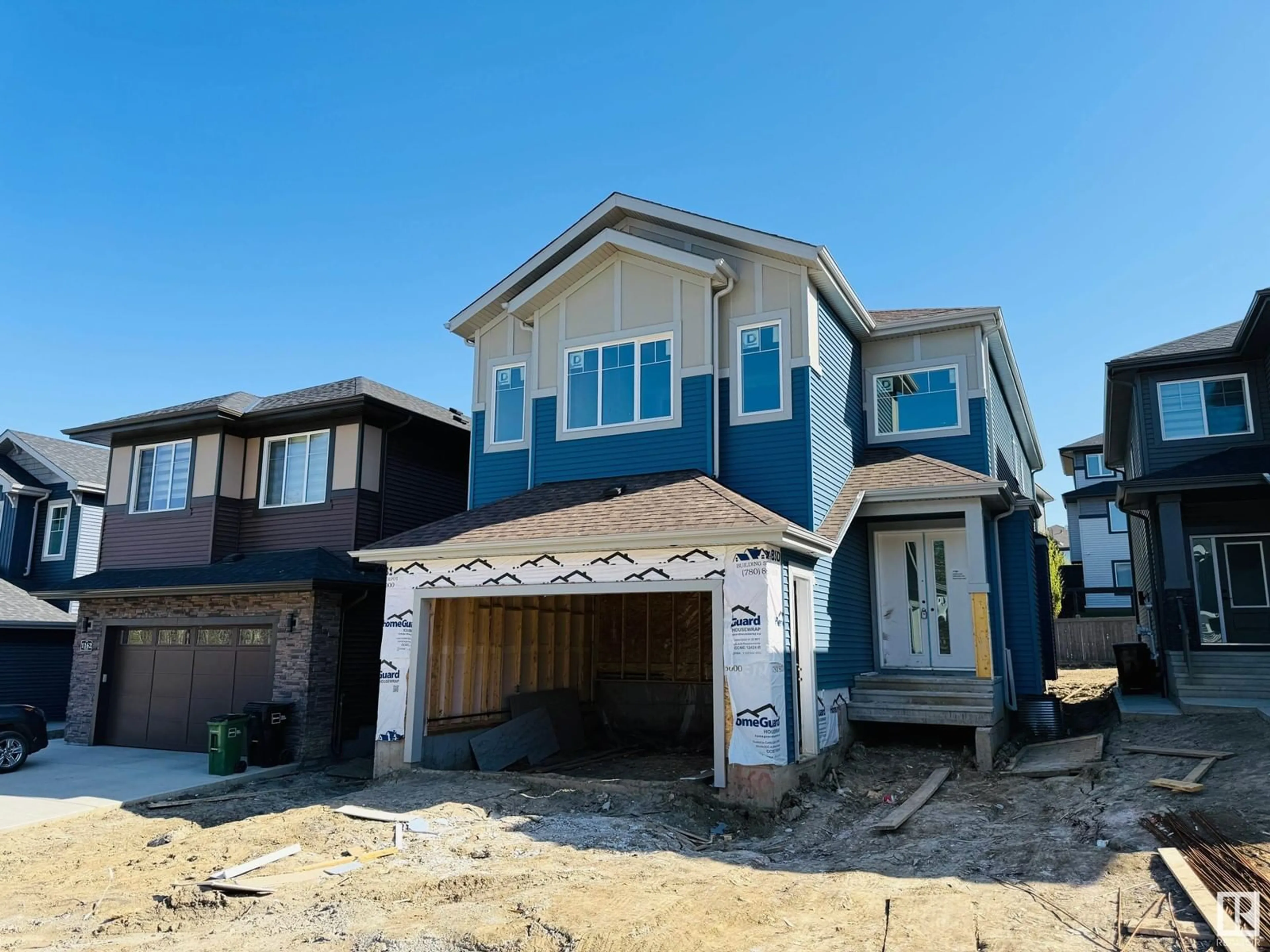 Home with vinyl exterior material, street for 1160 GYRFALCON CR, Edmonton Alberta T5S0S1