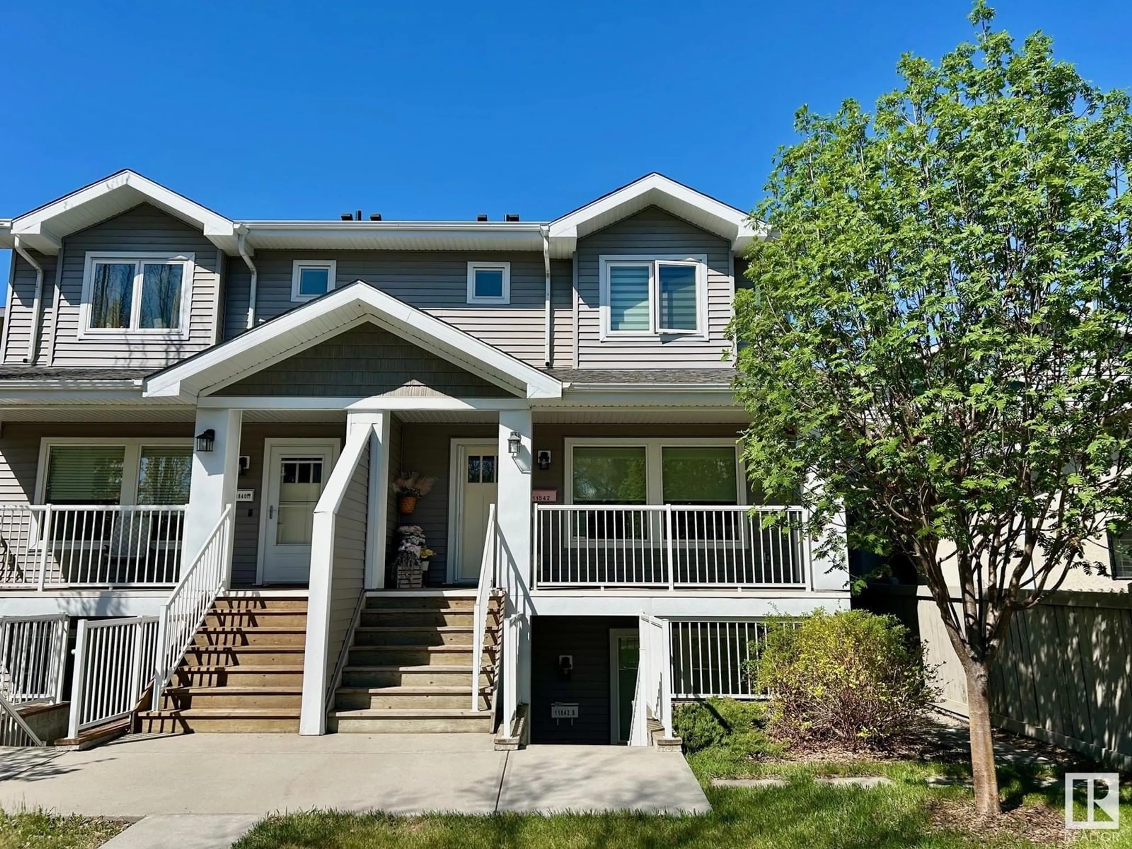 Home with vinyl exterior material, street for NW - 11842 122 ST, Edmonton Alberta T5L0C2