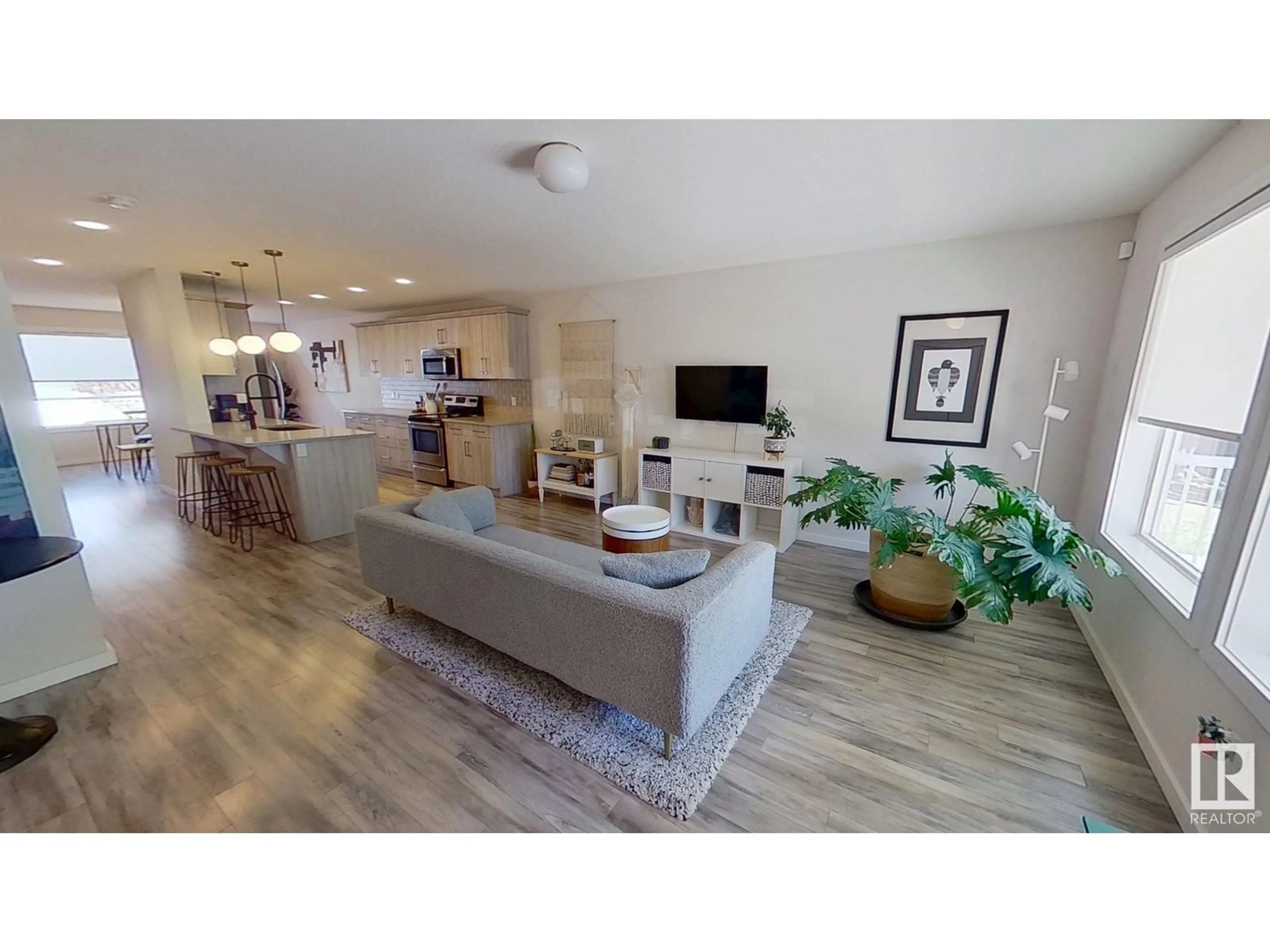 Living room with furniture, wood/laminate floor for NW - 11842 122 ST, Edmonton Alberta T5L0C2