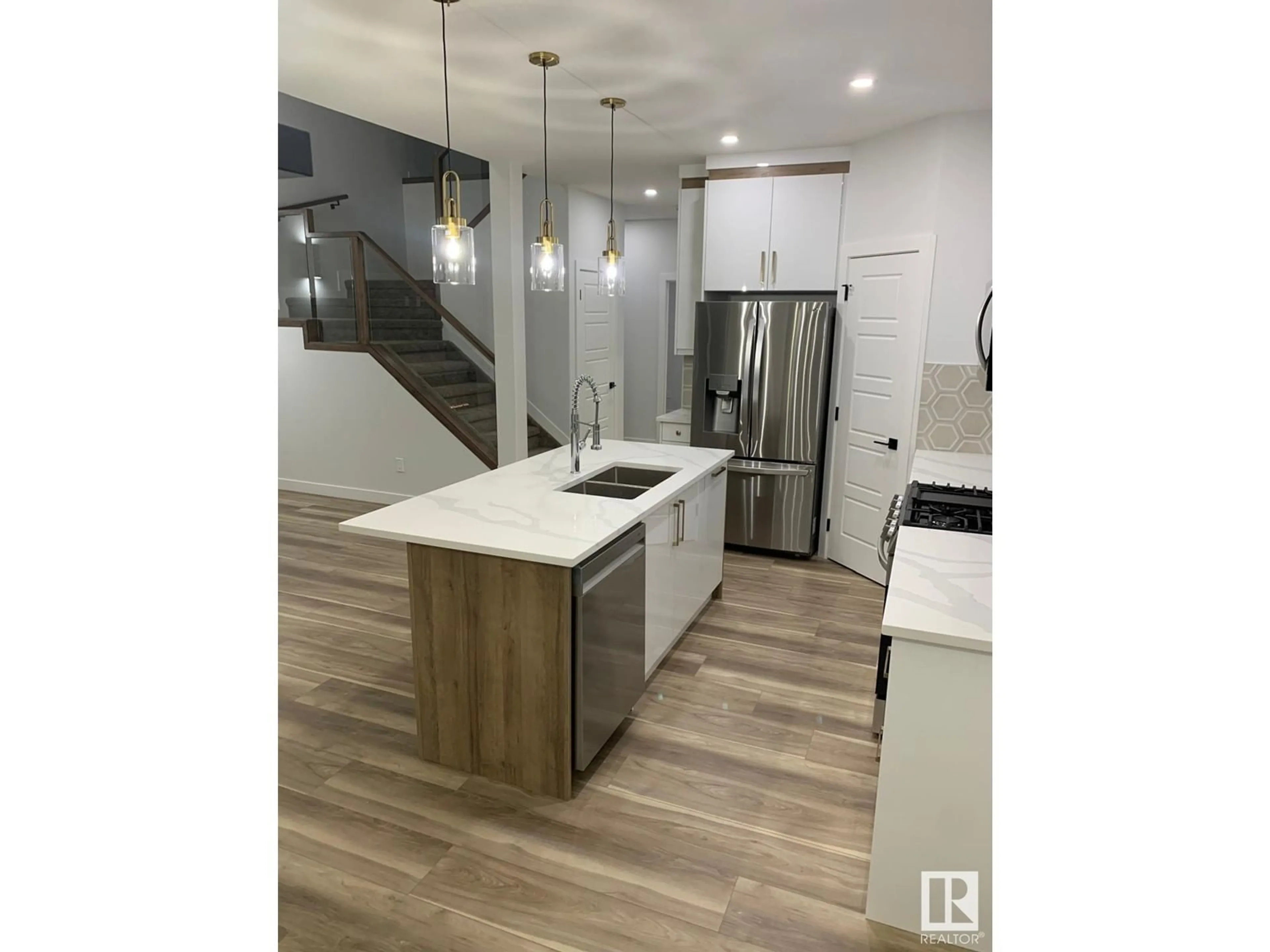 Open concept kitchen, wood/laminate floor for 17 HULL WD, Spruce Grove Alberta T7X0X5