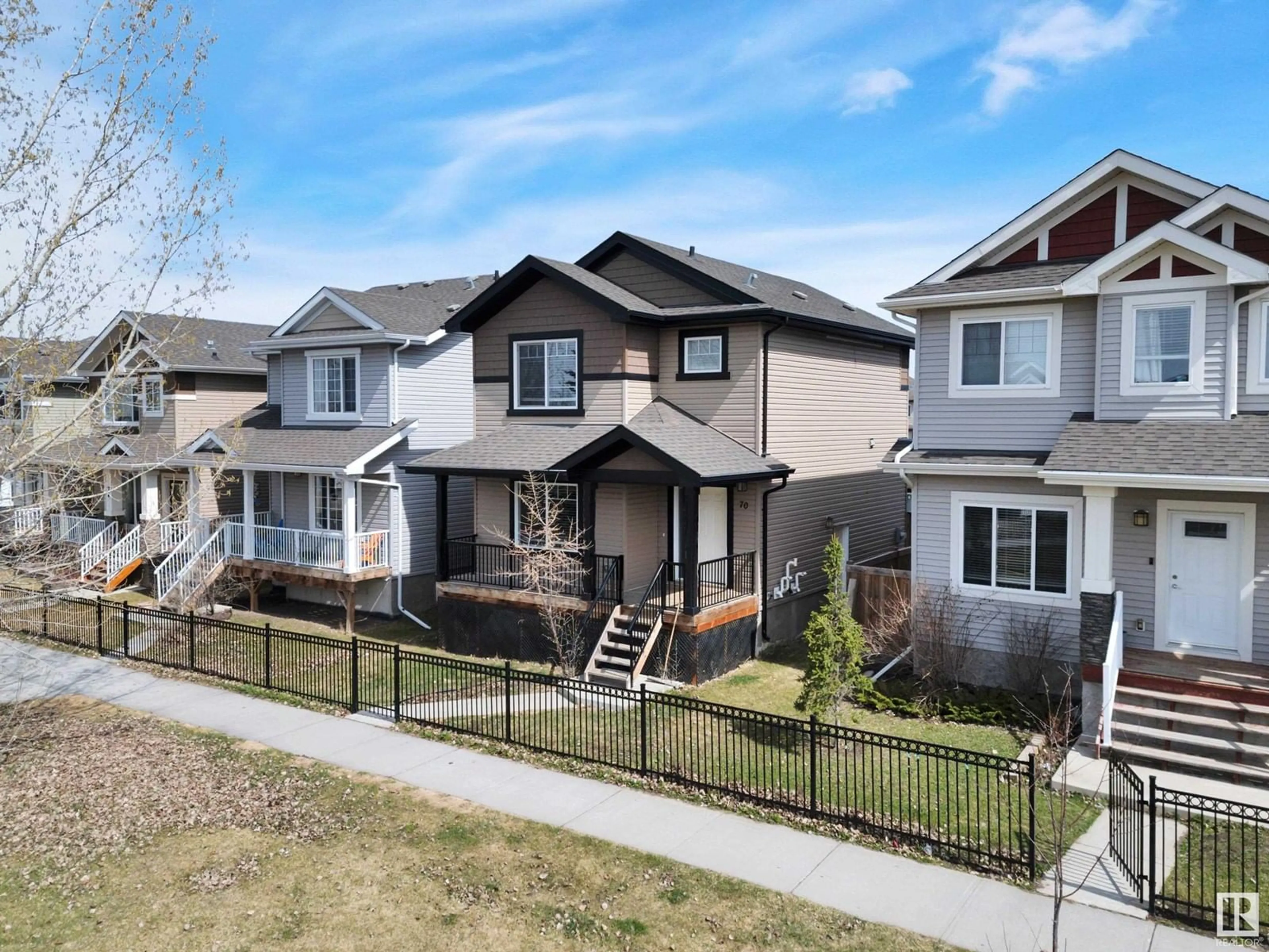 Home with vinyl exterior material, street for 70 STRAWBERRY LN, Leduc Alberta T9E8R6