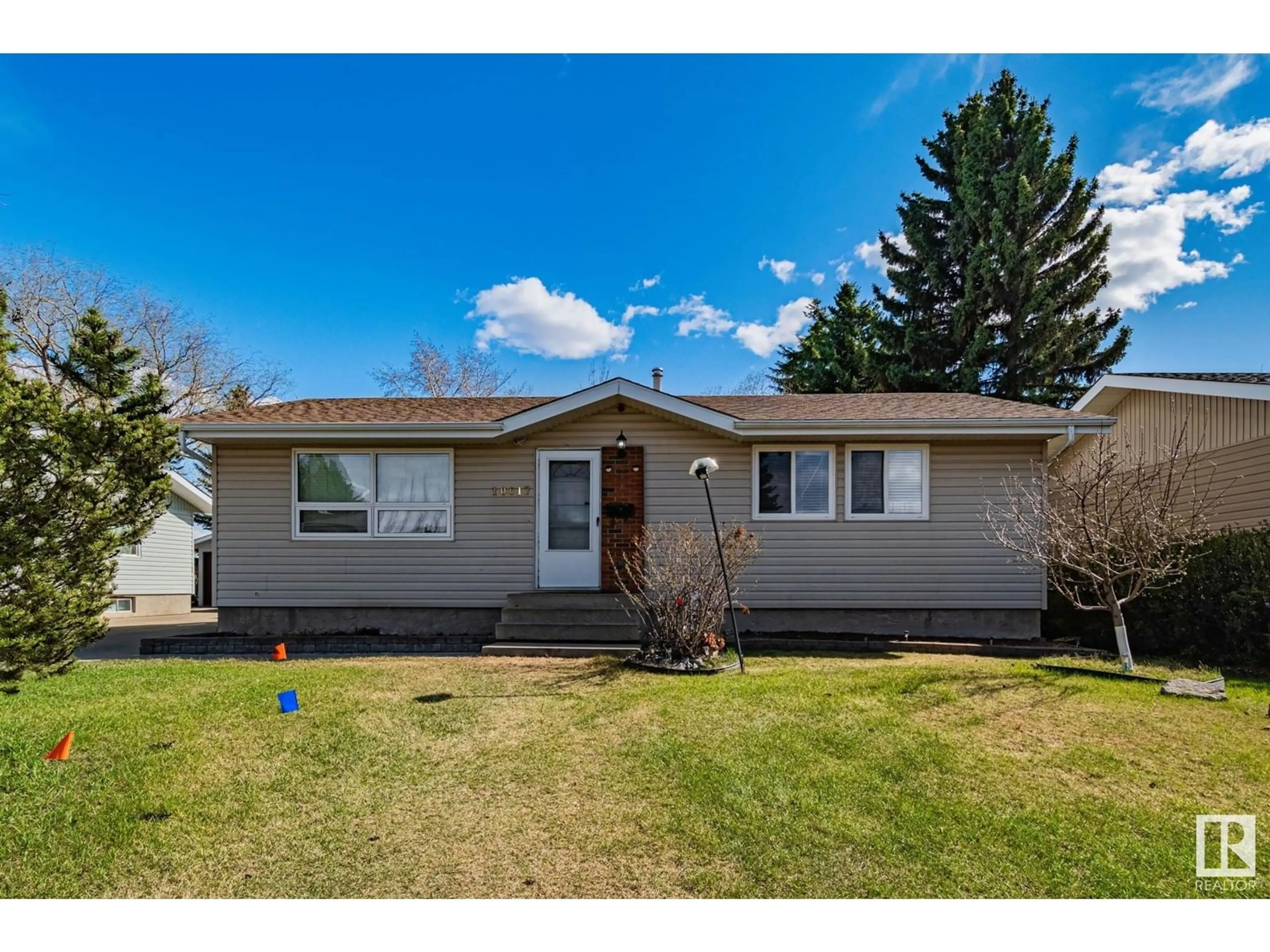 Home with vinyl exterior material, street for 10617 167A AV, Edmonton Alberta T5X2Y9