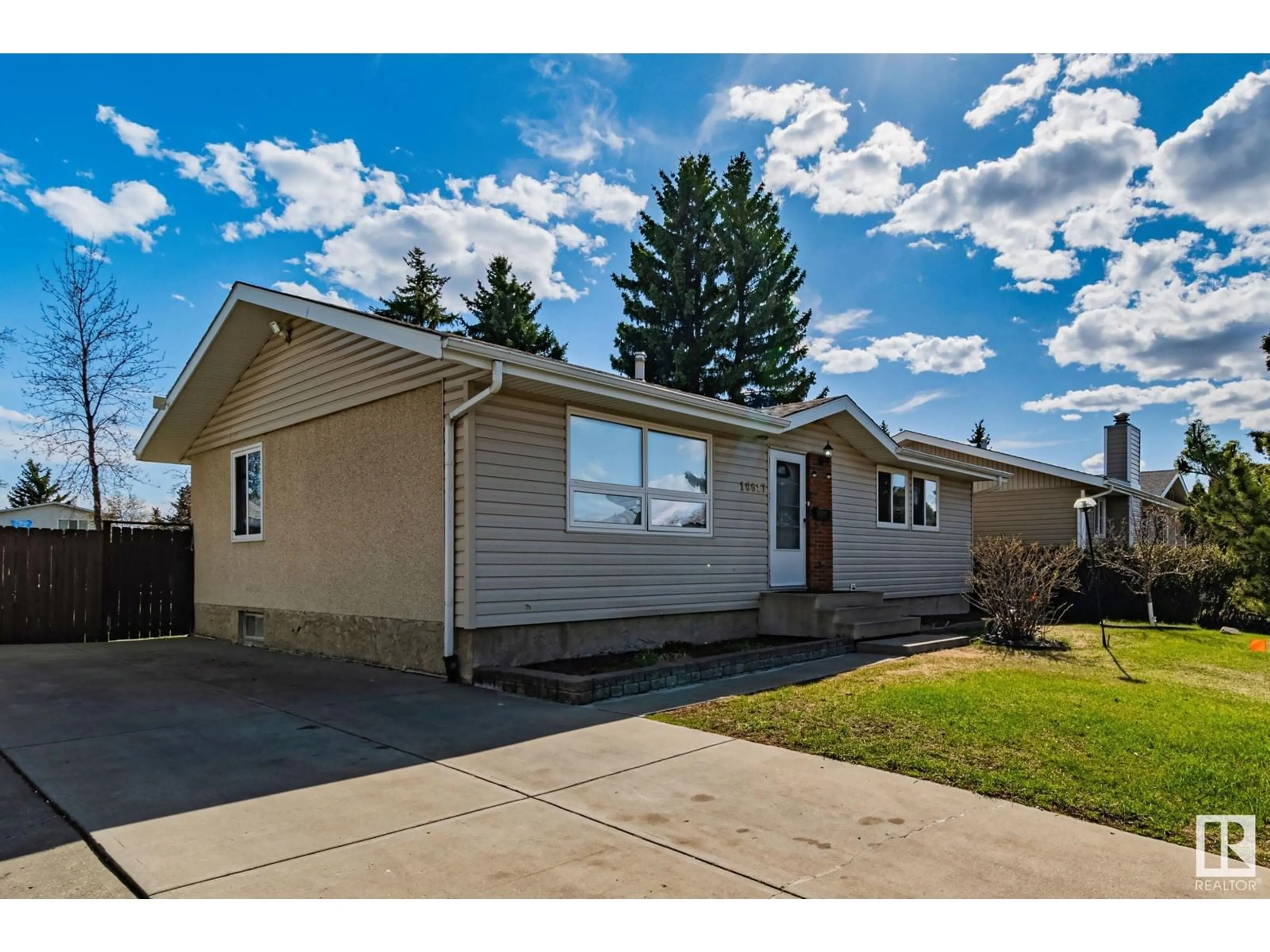 Home with vinyl exterior material, street for 10617 167A AV, Edmonton Alberta T5X2Y9