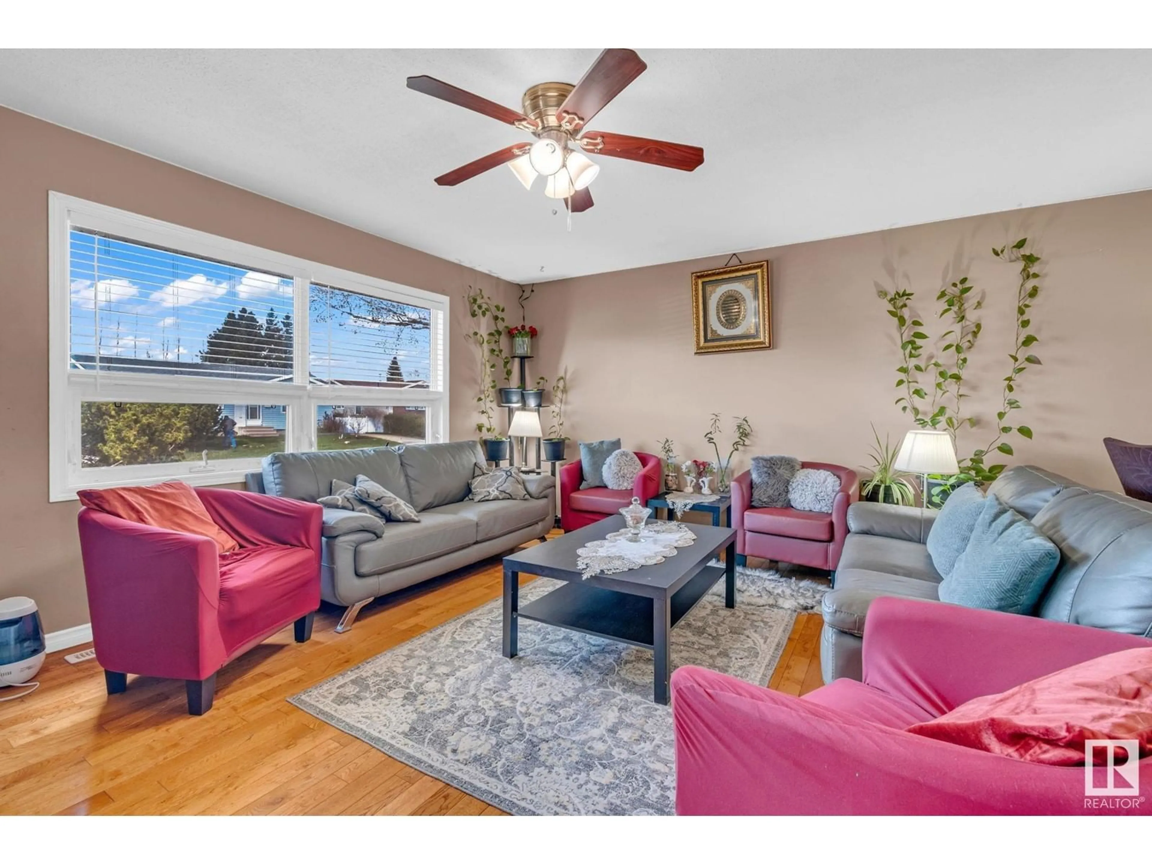 Living room with furniture, wood/laminate floor for 10617 167A AV, Edmonton Alberta T5X2Y9