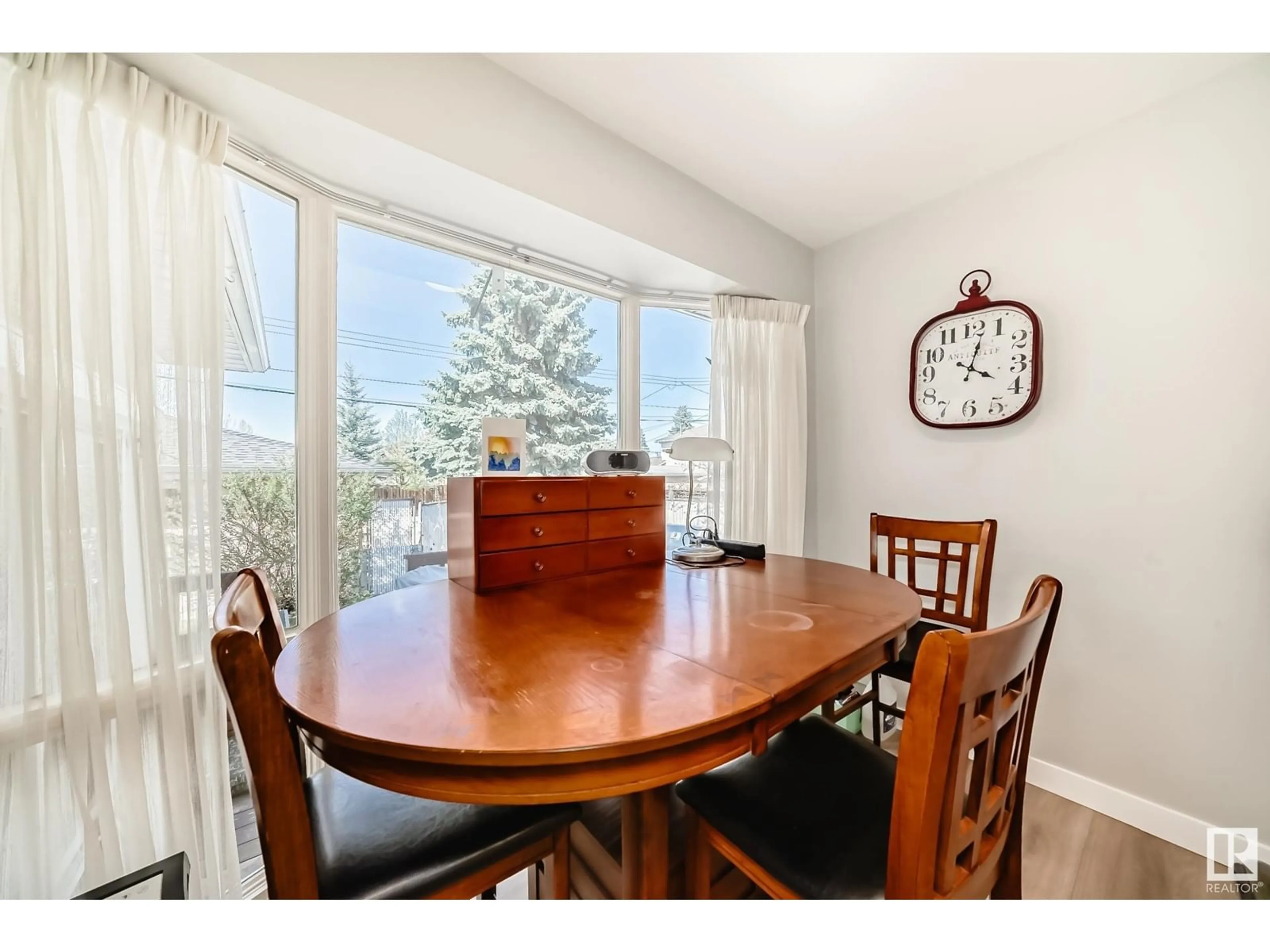 Dining room, wood/laminate floor for 11632 48 AV, Edmonton Alberta T6H0E6