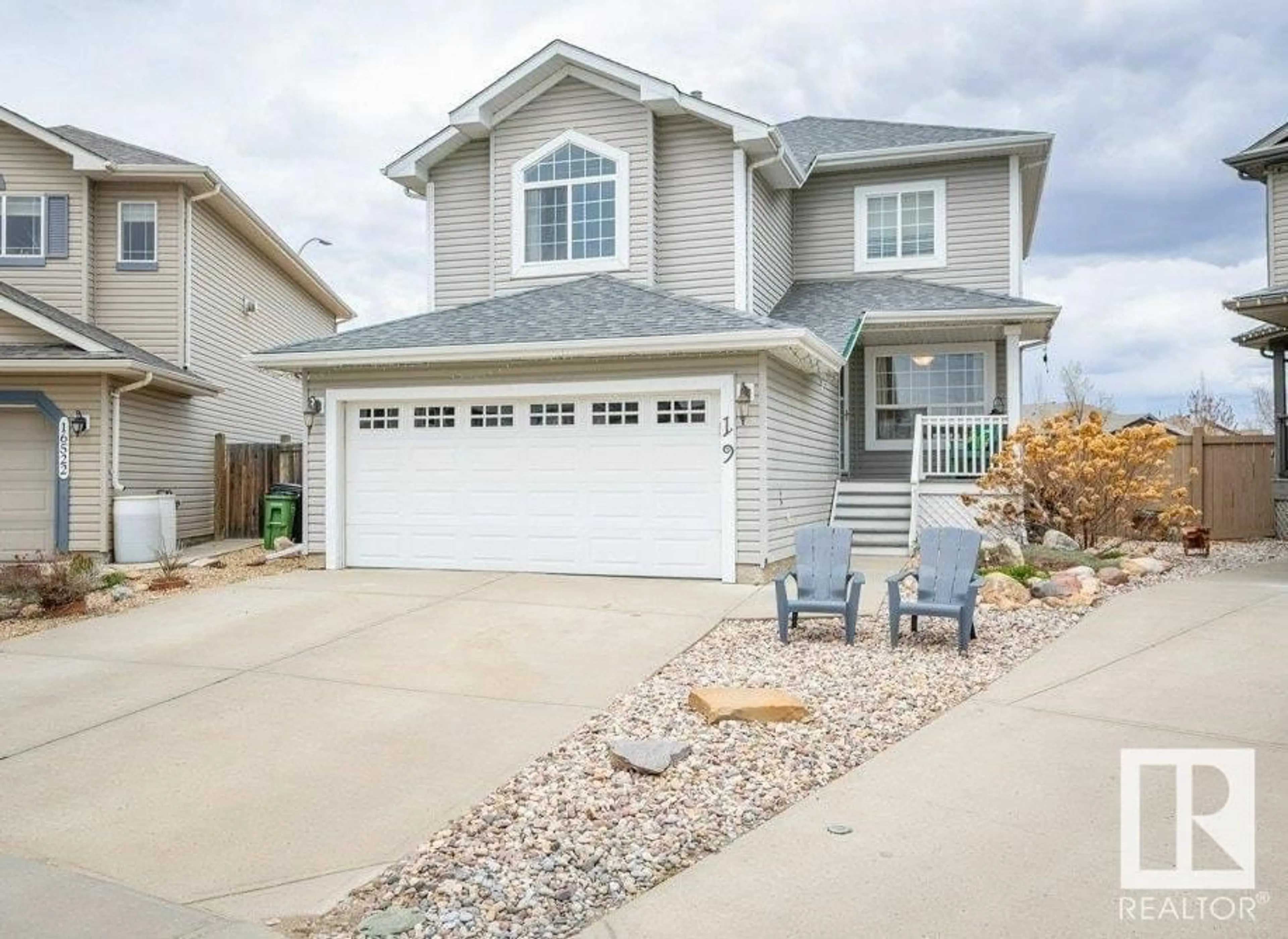 Home with vinyl exterior material, street for 16519 56 ST NW, Edmonton Alberta T5Y3M7