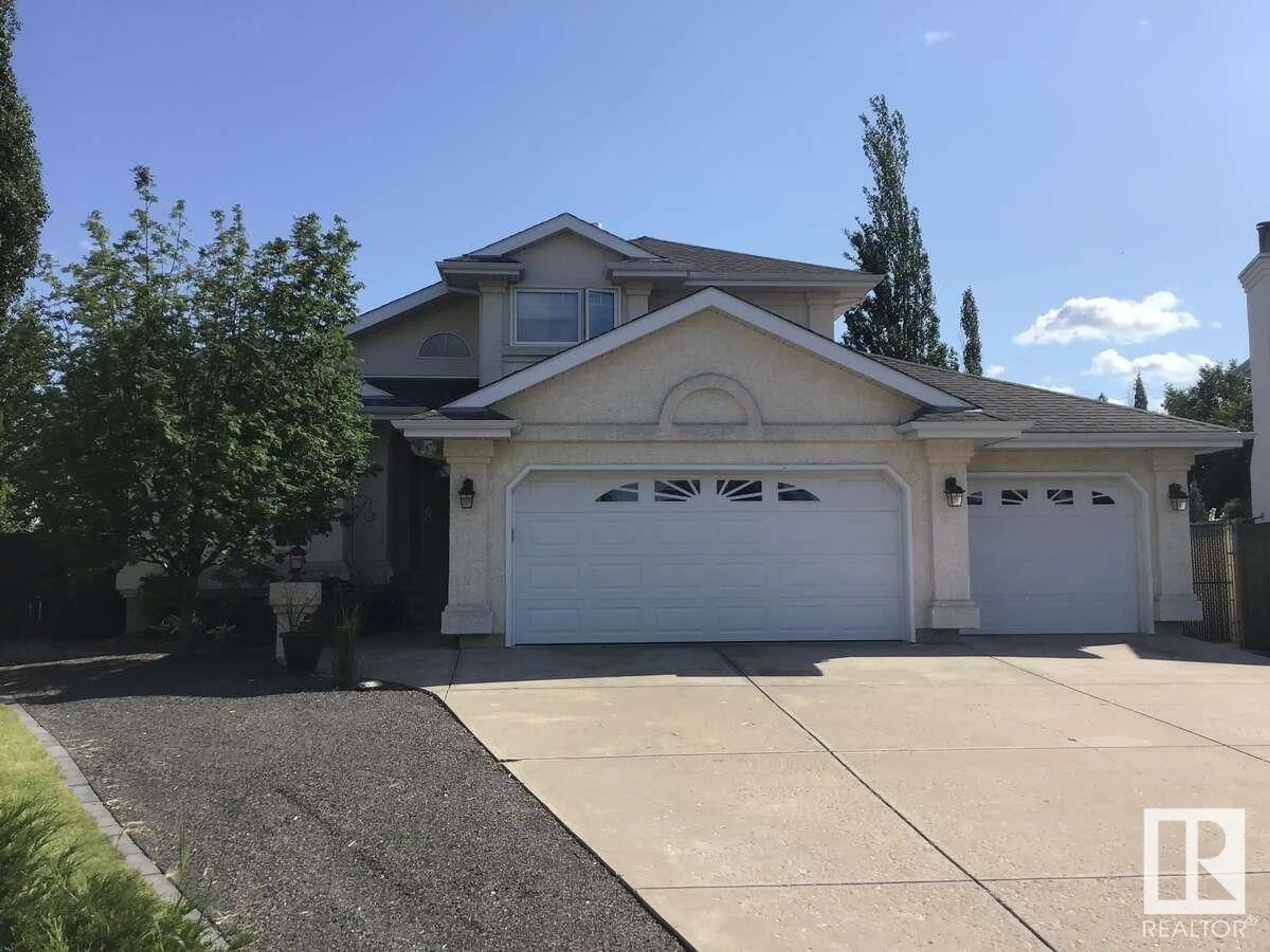 Home with vinyl exterior material, street for 11409 12 AV, Edmonton Alberta T6J6W8