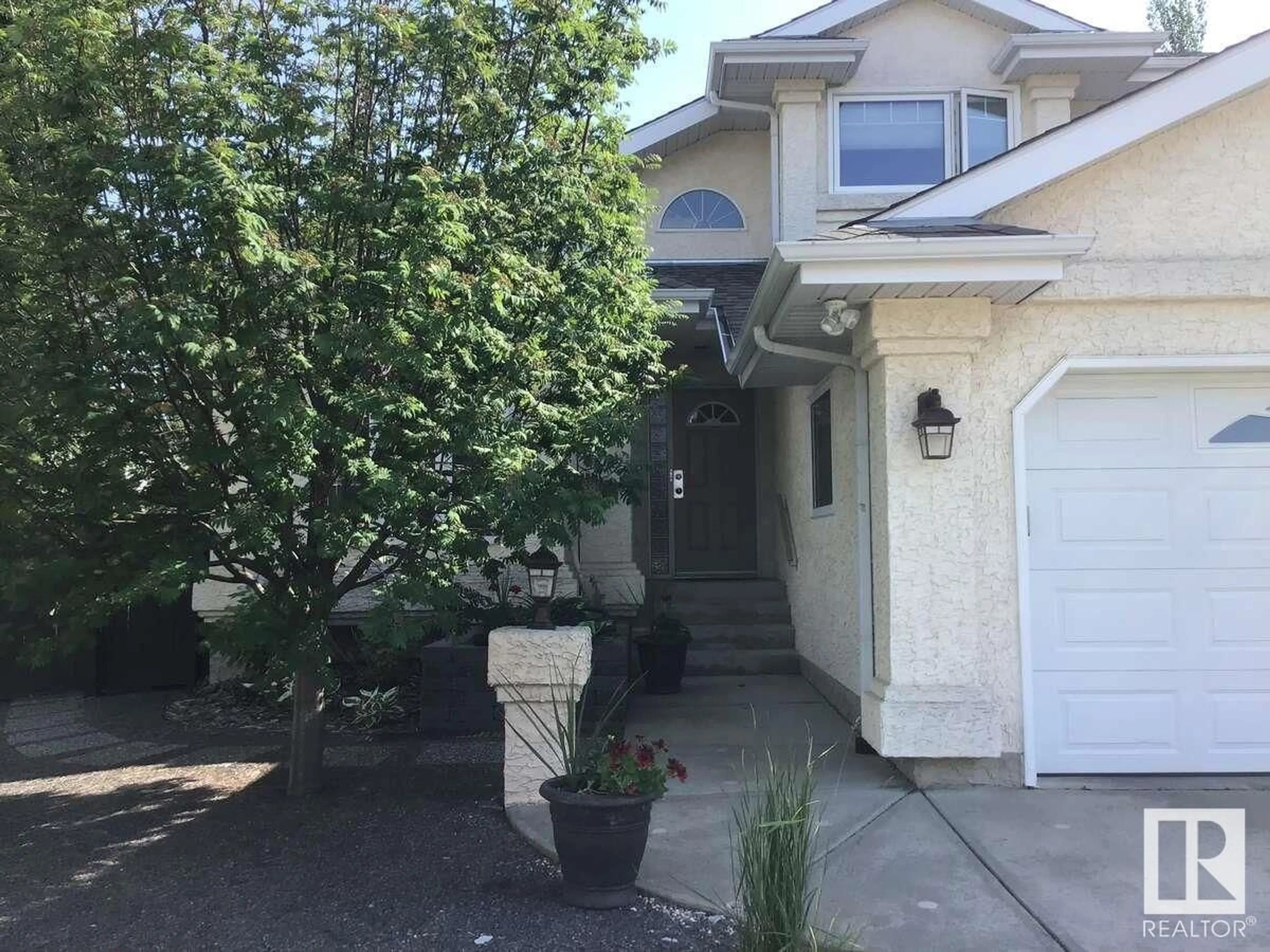 Home with vinyl exterior material, street for 11409 12 AV, Edmonton Alberta T6J6W8