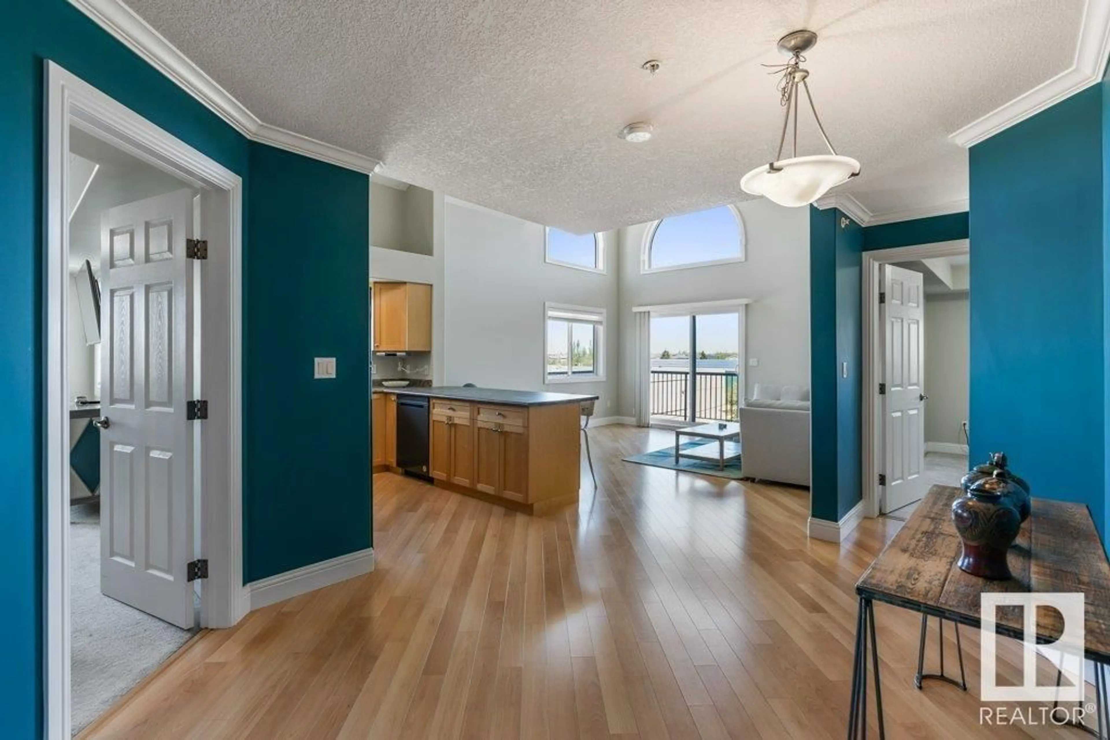 Open concept kitchen, wood/laminate floor for #416 - 13111 140 AV, Edmonton Alberta T6V0B1