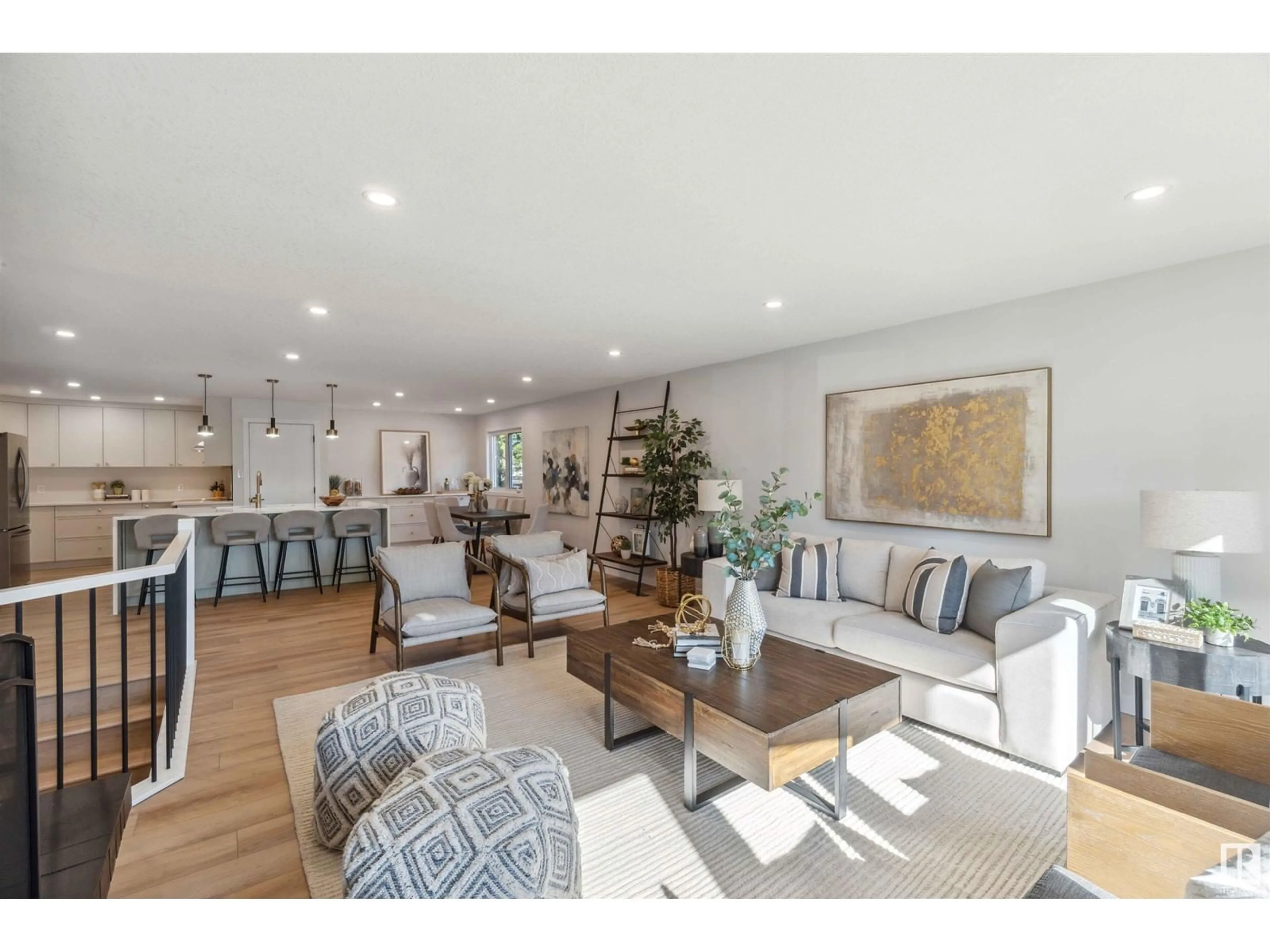 Living room with furniture, wood/laminate floor for 8604 52 ST, Edmonton Alberta T6B1E9
