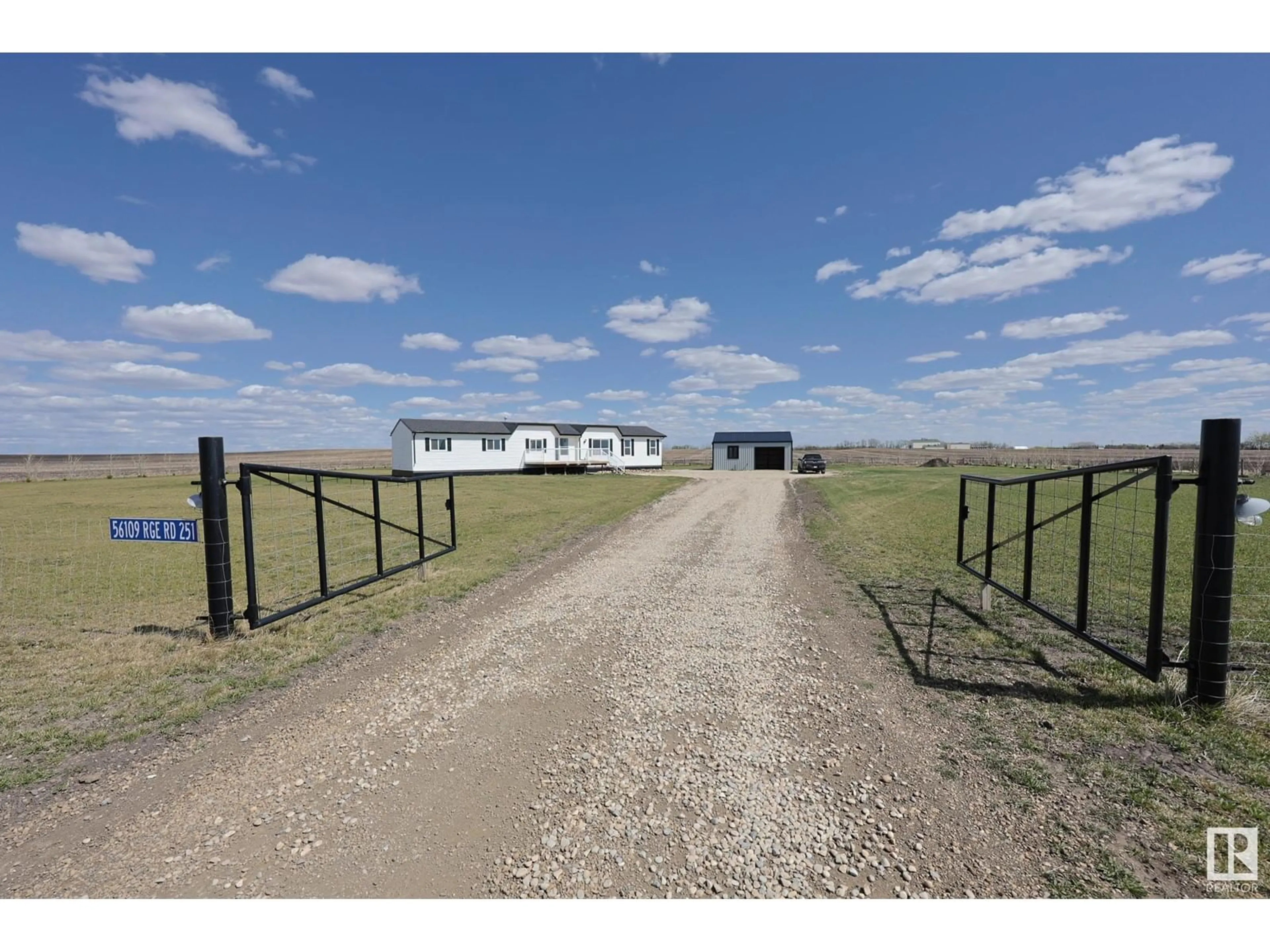 A pic from outside/outdoor area/front of a property/back of a property/a pic from drone, street for 56109 RR 251, Rural Sturgeon County Alberta T8R0P1