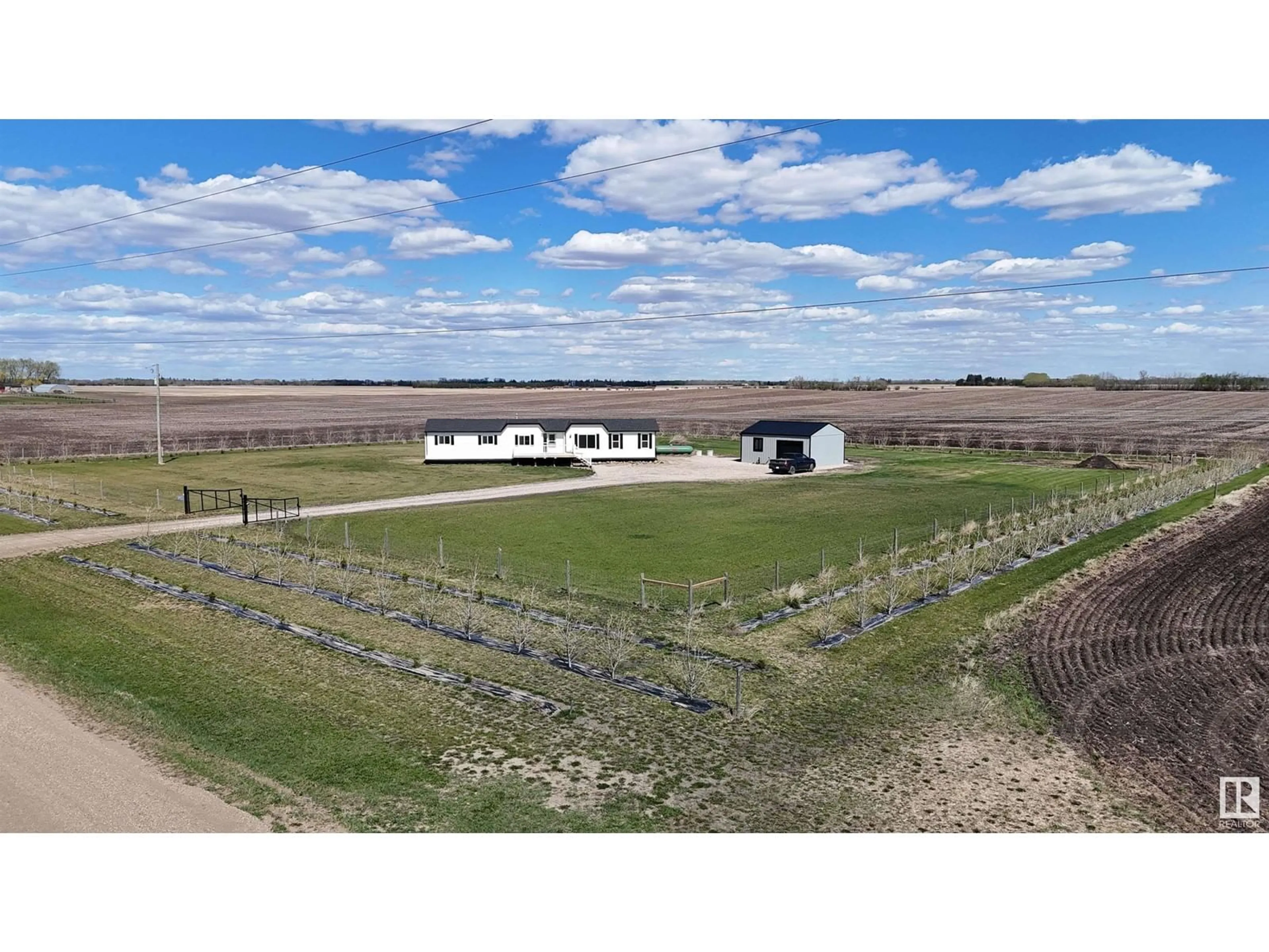 A pic from outside/outdoor area/front of a property/back of a property/a pic from drone, building for 56109 RR 251, Rural Sturgeon County Alberta T8R0P1