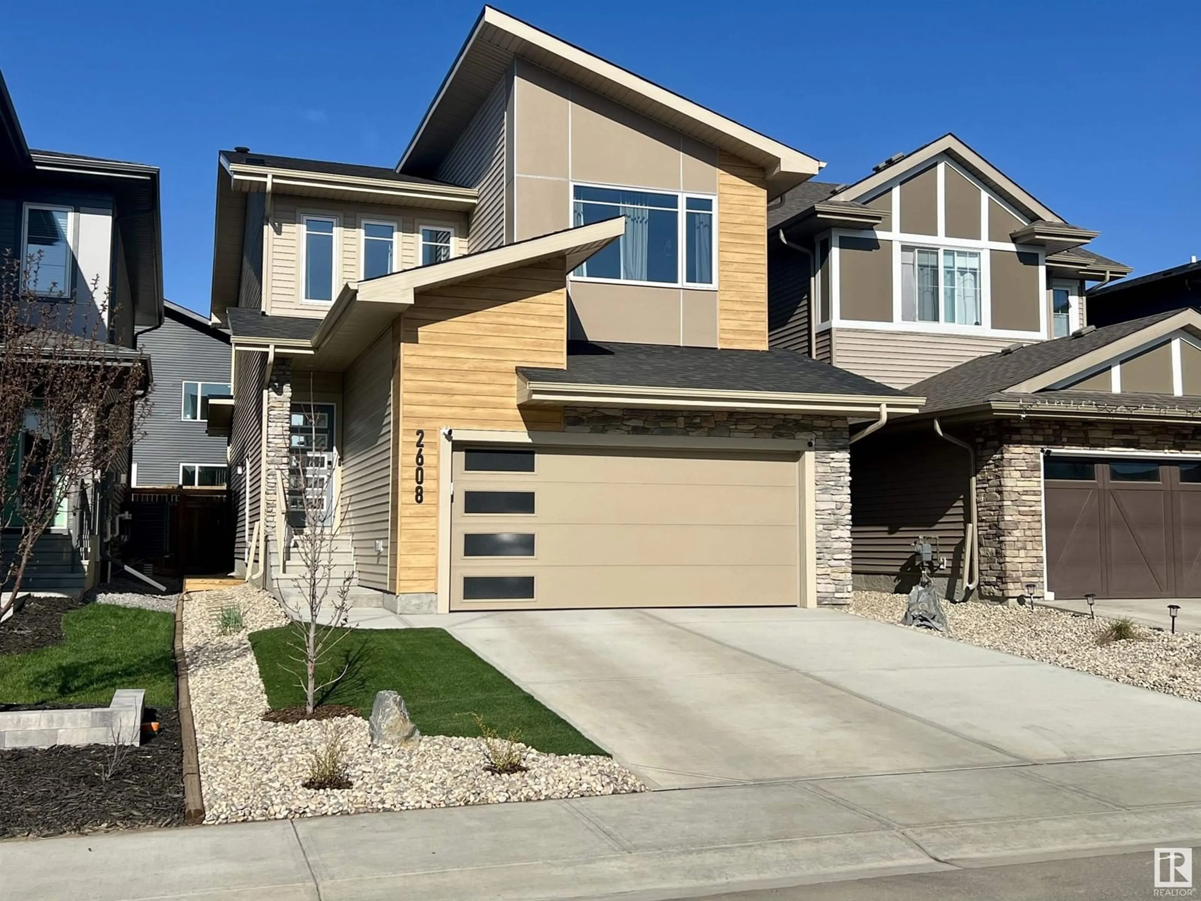 Home with vinyl exterior material, street for NW - 2608 208 ST, Edmonton Alberta T6M1P3