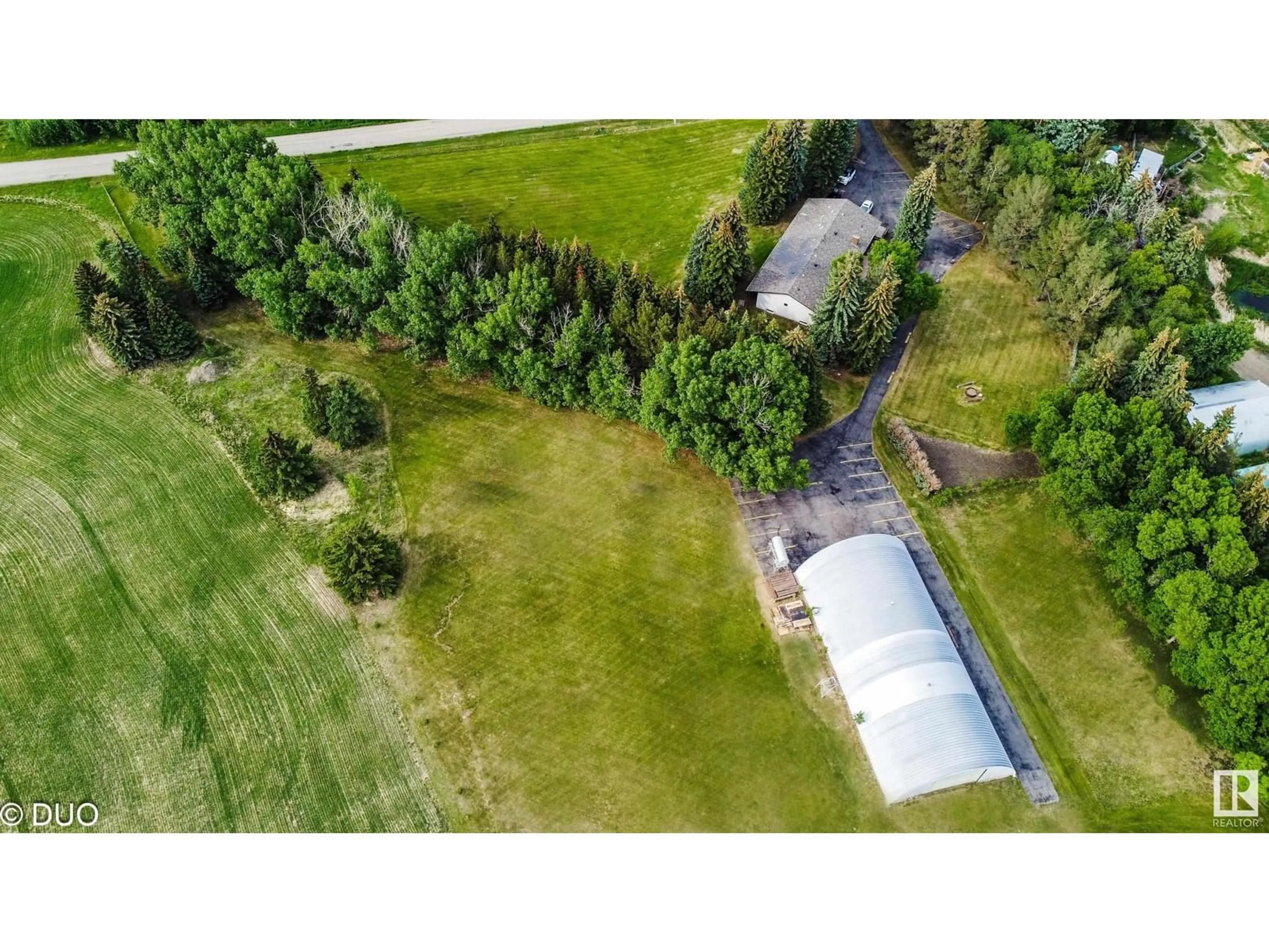 A pic from outside/outdoor area/front of a property/back of a property/a pic from drone, unknown for 24041 TWP ROAD 510, Rural Leduc County Alberta T4X0T1
