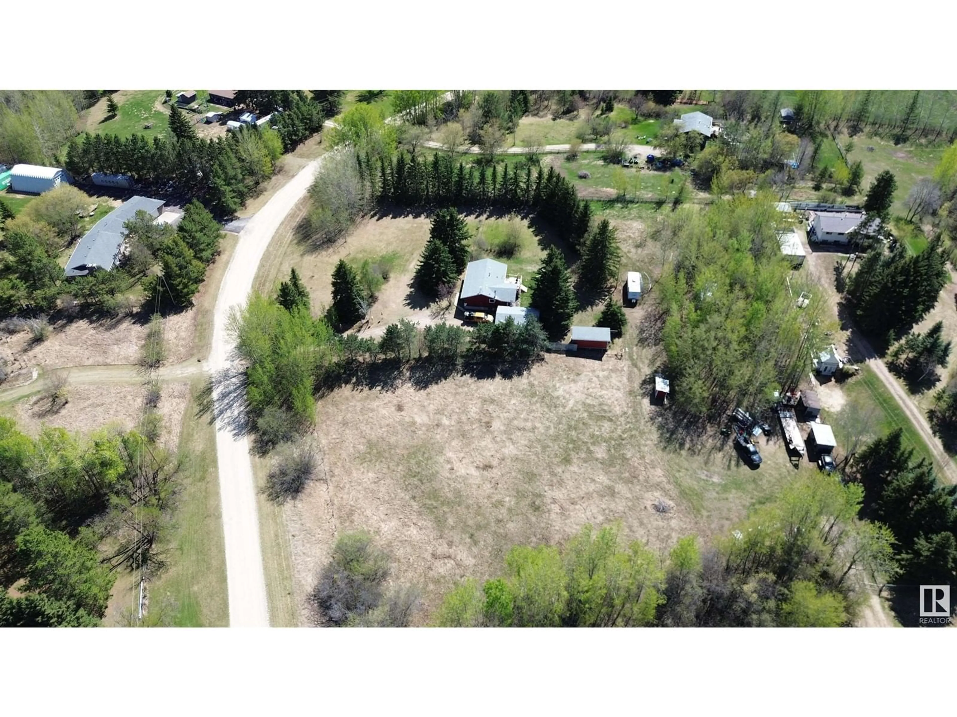 A pic from outside/outdoor area/front of a property/back of a property/a pic from drone, forest/trees view for 54 - 53417 RGE ROAD 14, Rural Parkland County Alberta T7Y0B5