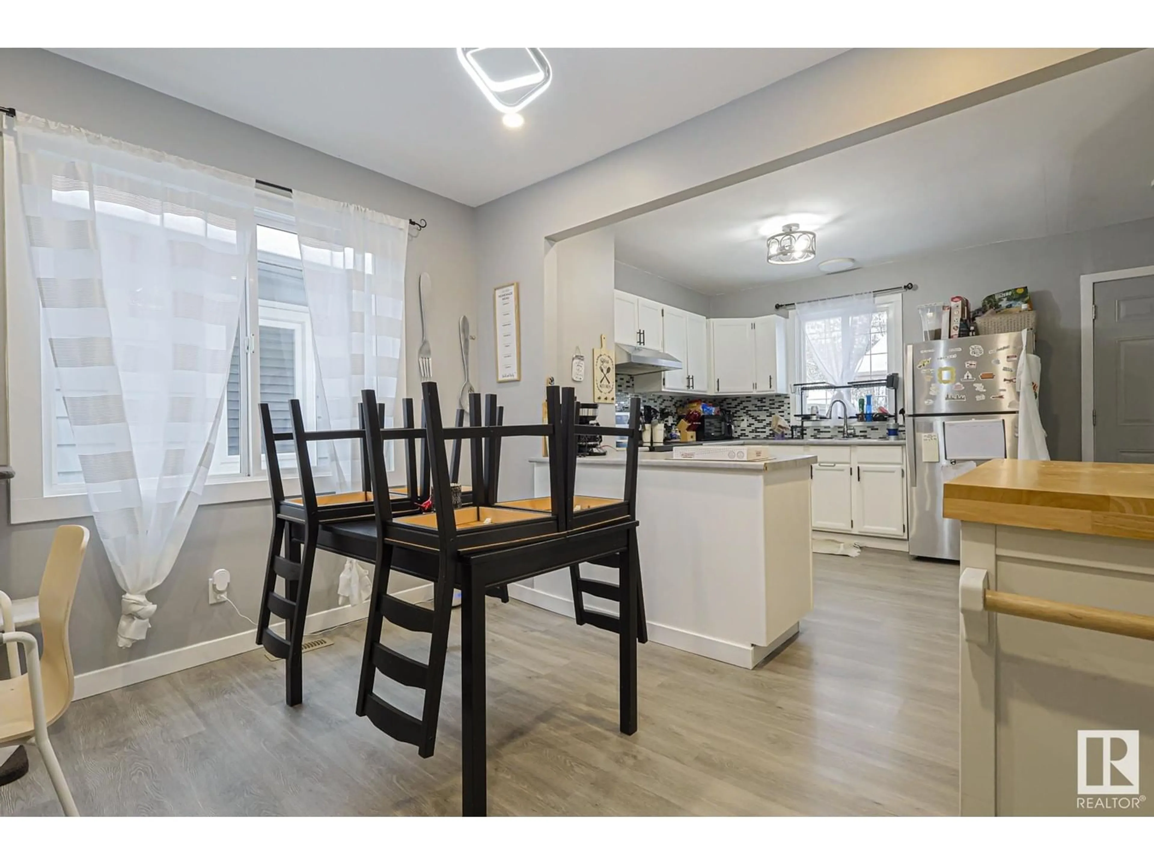 Open concept kitchen, wood/laminate floor for NW - 11540 83 ST, Edmonton Alberta T5B2Y5