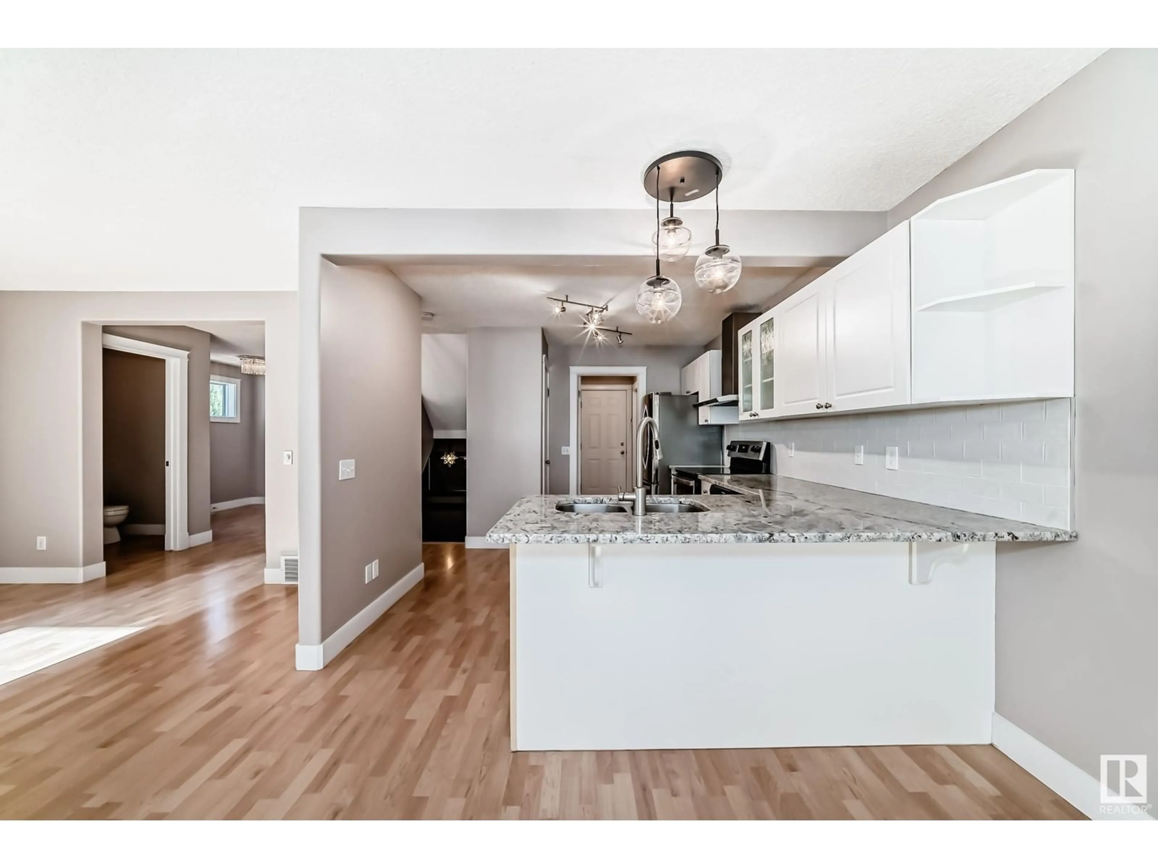 Open concept kitchen, wood/laminate floor for 3 IRONWOOD FAIRWAY CL, Stony Plain Alberta T7Z2K8
